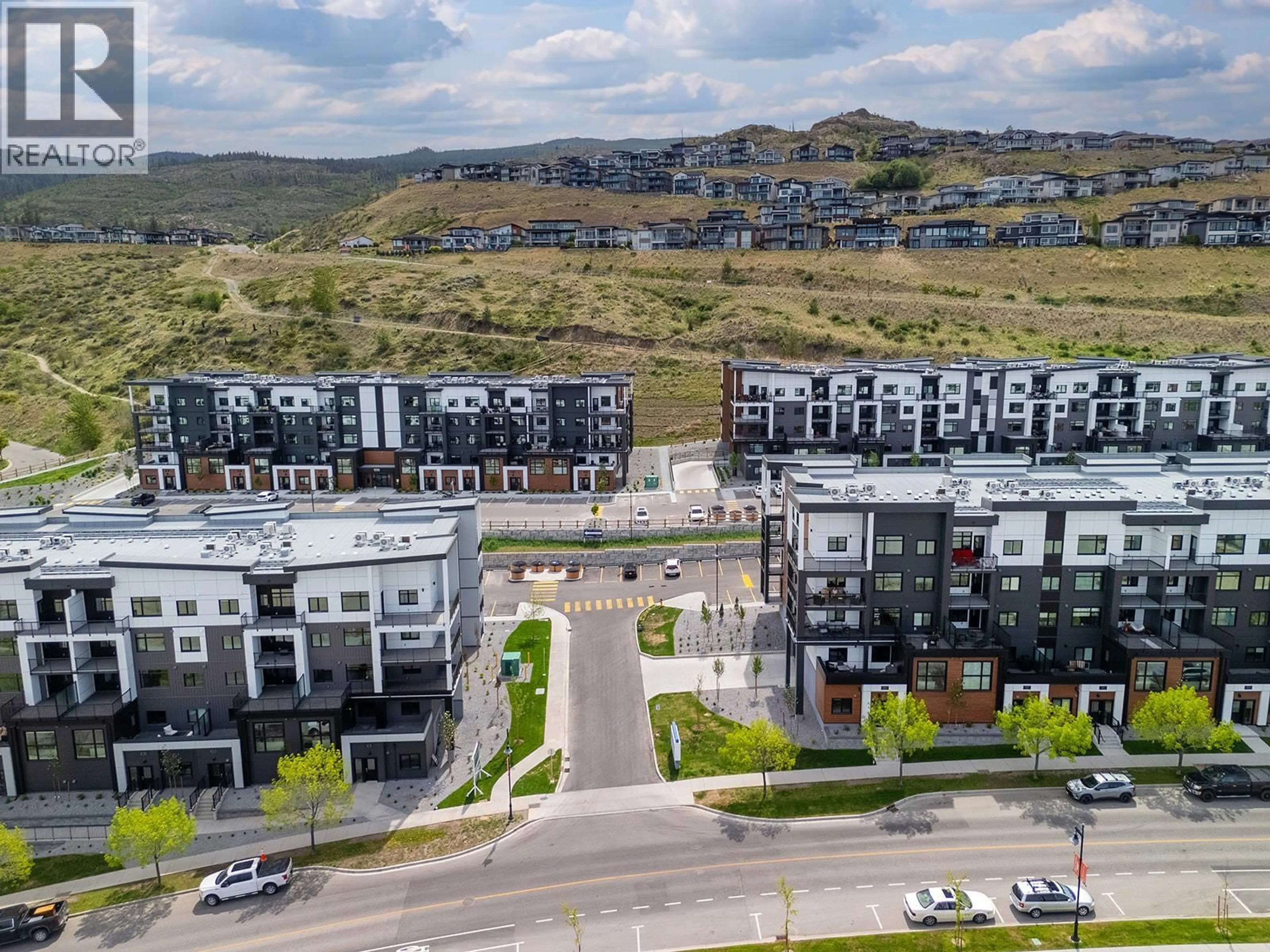 A pic from outside/outdoor area/front of a property/back of a property/a pic from drone, mountain view for 118 - 1057 FROST ROAD, Kelowna British Columbia V1W0G7