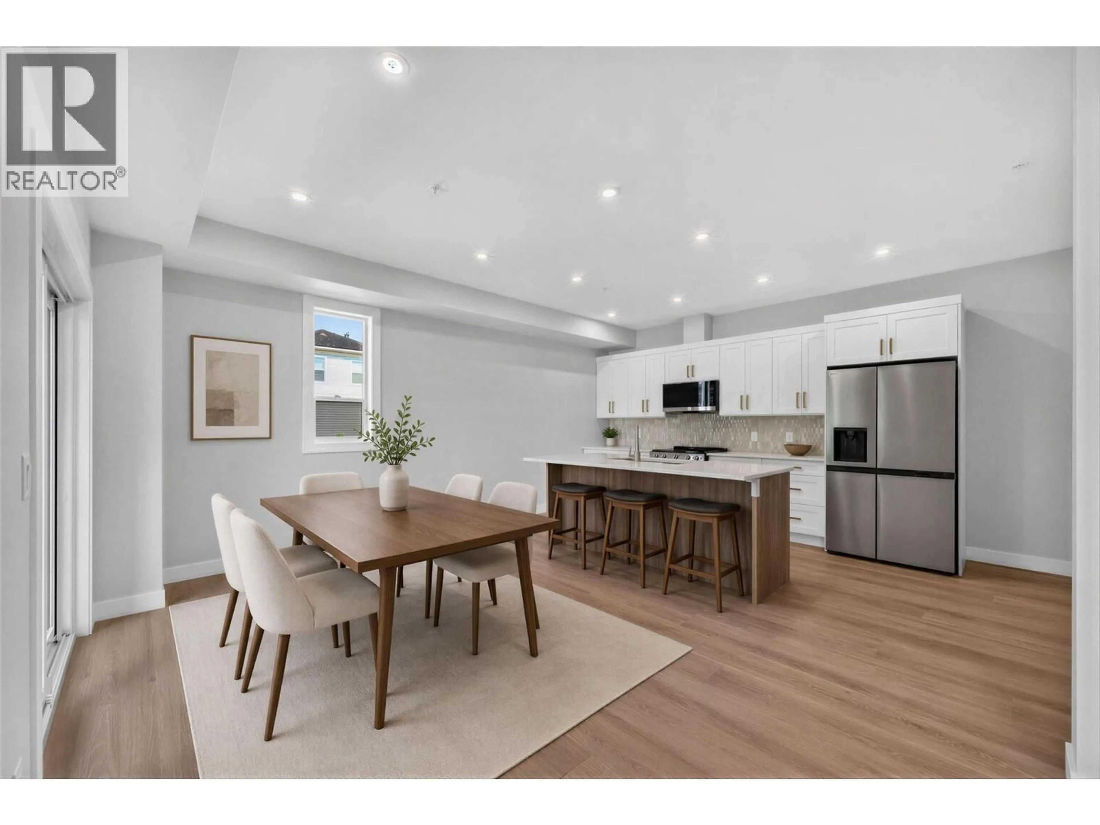 Open concept kitchen, wood/laminate floor for 4 - 2009 39 AVENUE, Vernon British Columbia V1T8E5