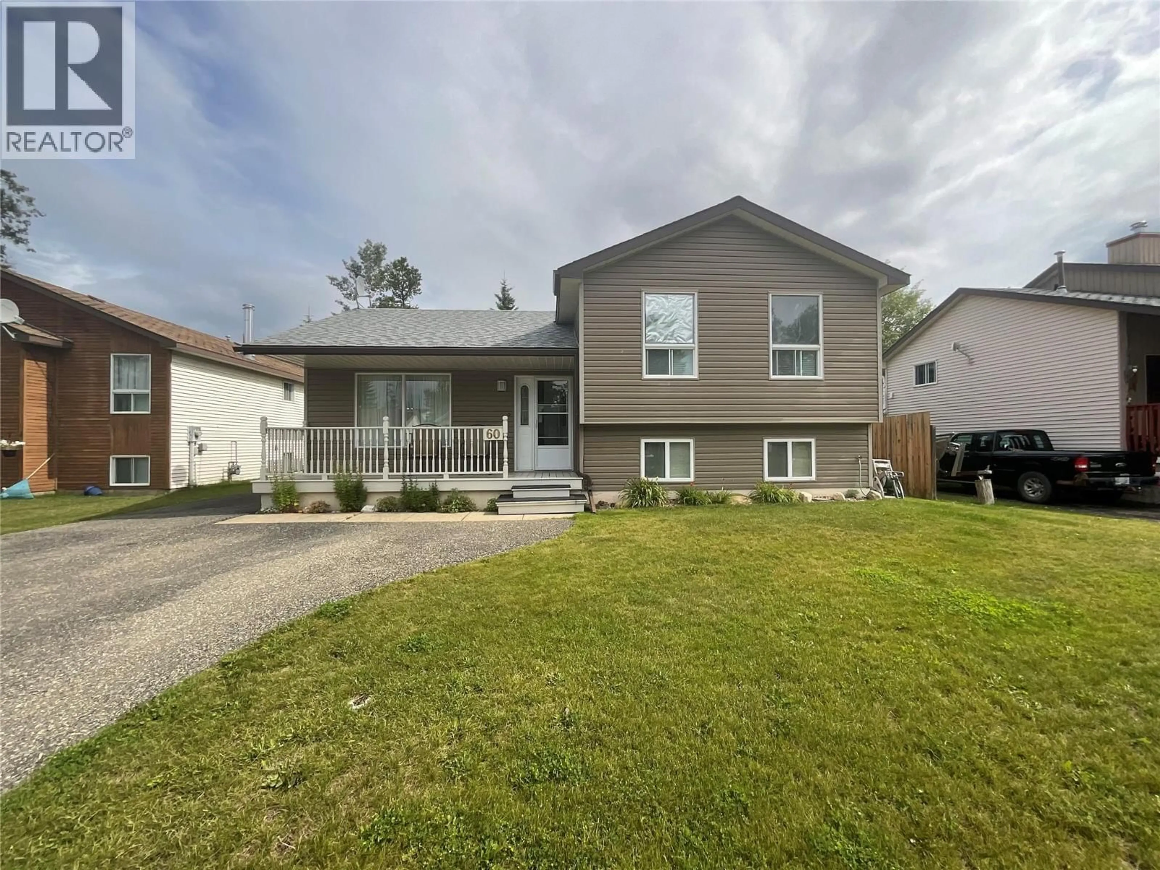 Home with vinyl exterior material, street for 60 VALLEYVIEW PLACE, Tumbler Ridge British Columbia V0C2W0
