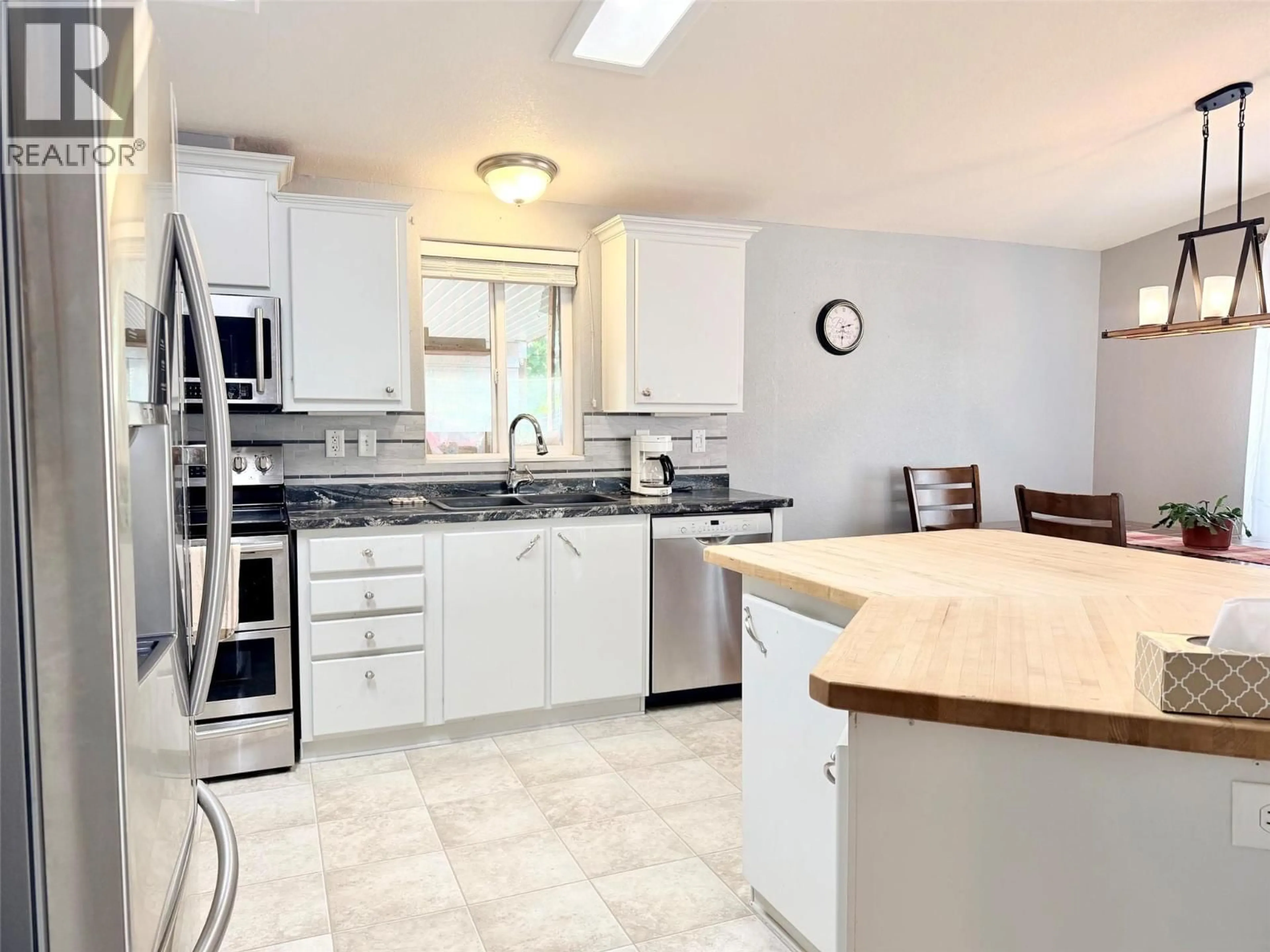 Open concept kitchen, ceramic/tile floor for 411 3RD AVENUE SOUTH, Creston British Columbia V0B1G3