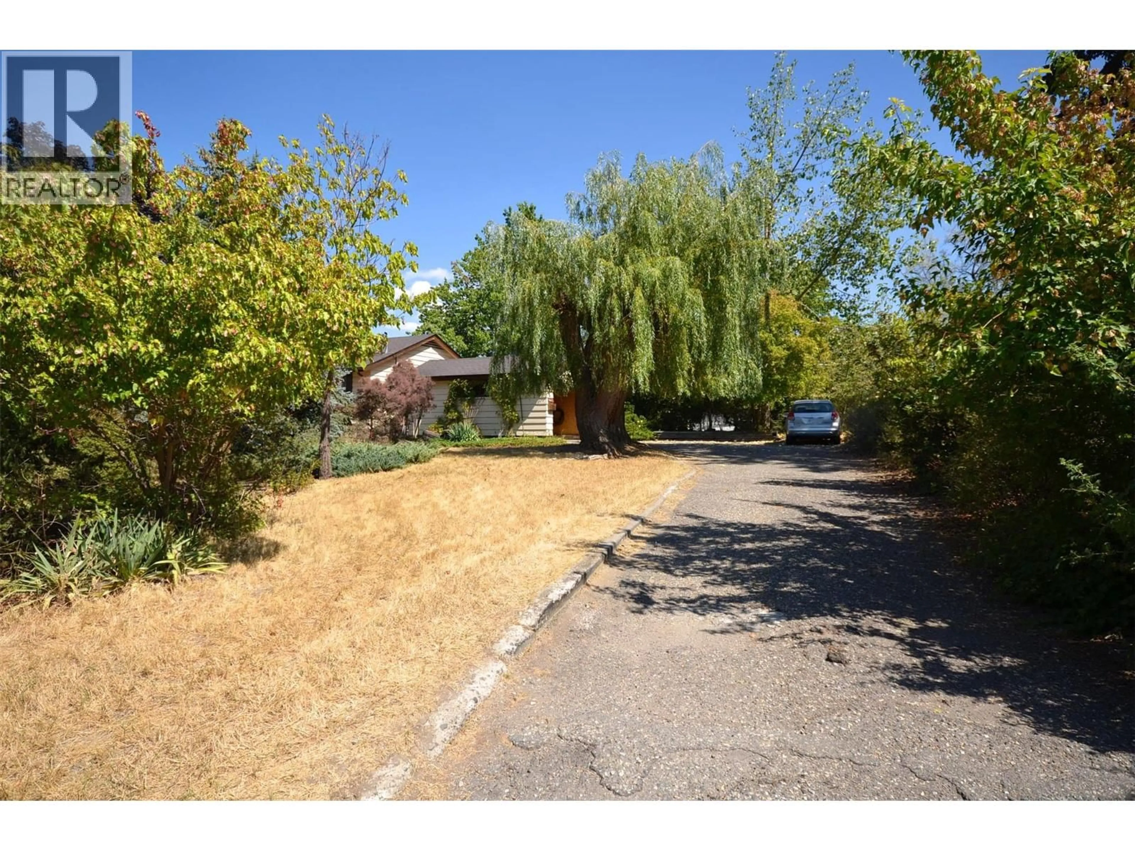 A pic from outside/outdoor area/front of a property/back of a property/a pic from drone, street for 7609 CUNLIFFE ROAD, Coldstream British Columbia V1B1T4