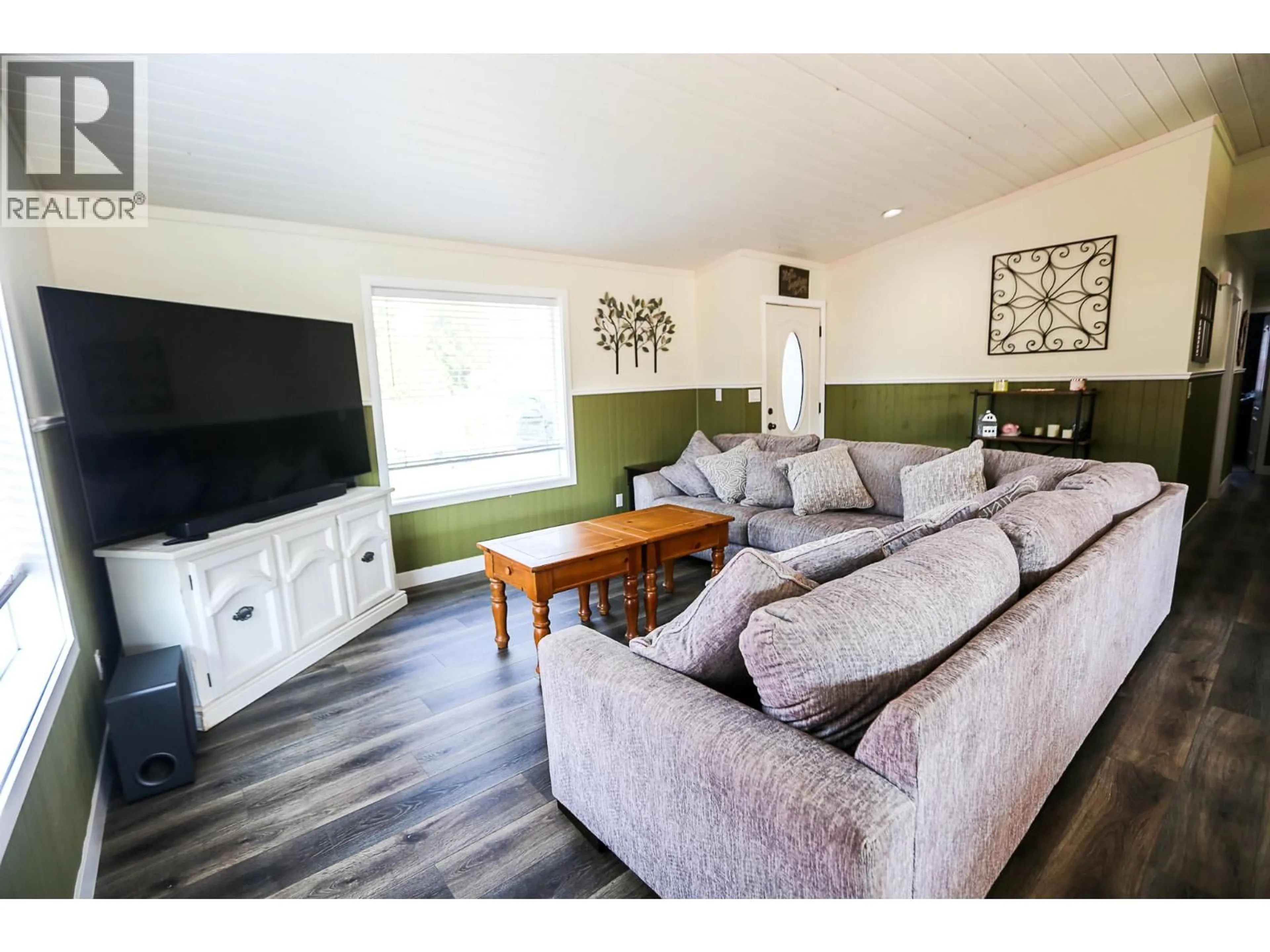 Living room with furniture, wood/laminate floor for 566 MCLEAN ROAD, Barriere British Columbia V0E1E0