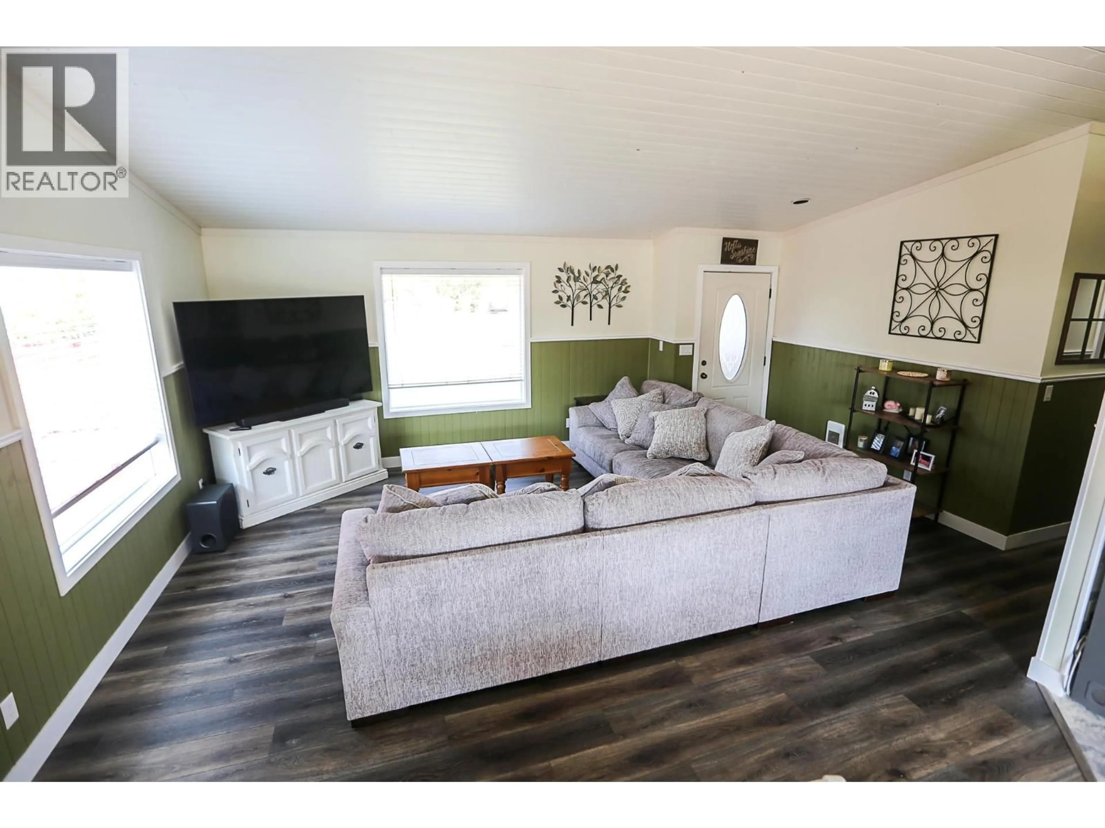 Living room with furniture, wood/laminate floor for 566 MCLEAN ROAD, Barriere British Columbia V0E1E0