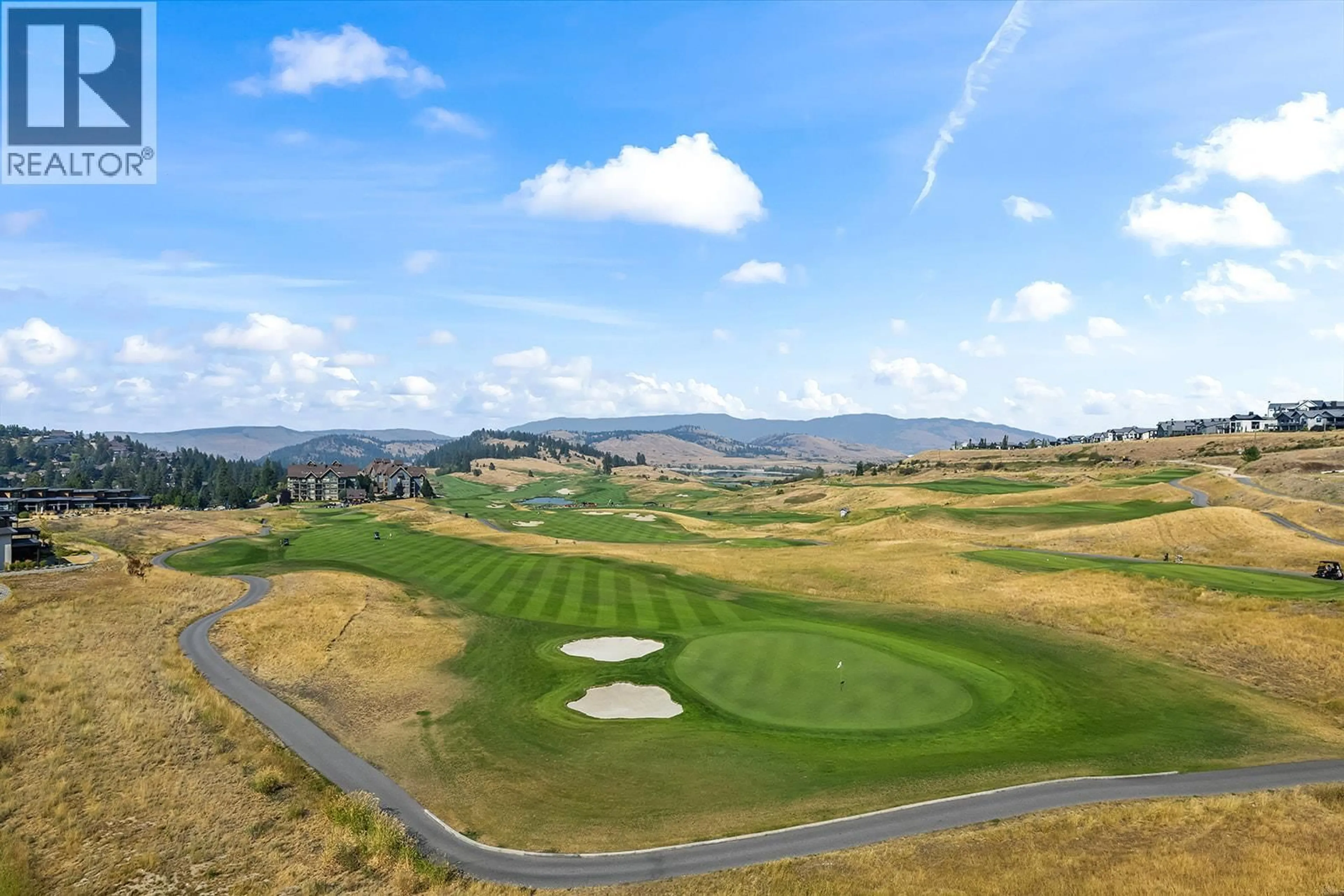 A pic from outside/outdoor area/front of a property/back of a property/a pic from drone, mountain view for 502 - 75 PREDATOR RIDGE DRIVE, Vernon British Columbia V1H1G4