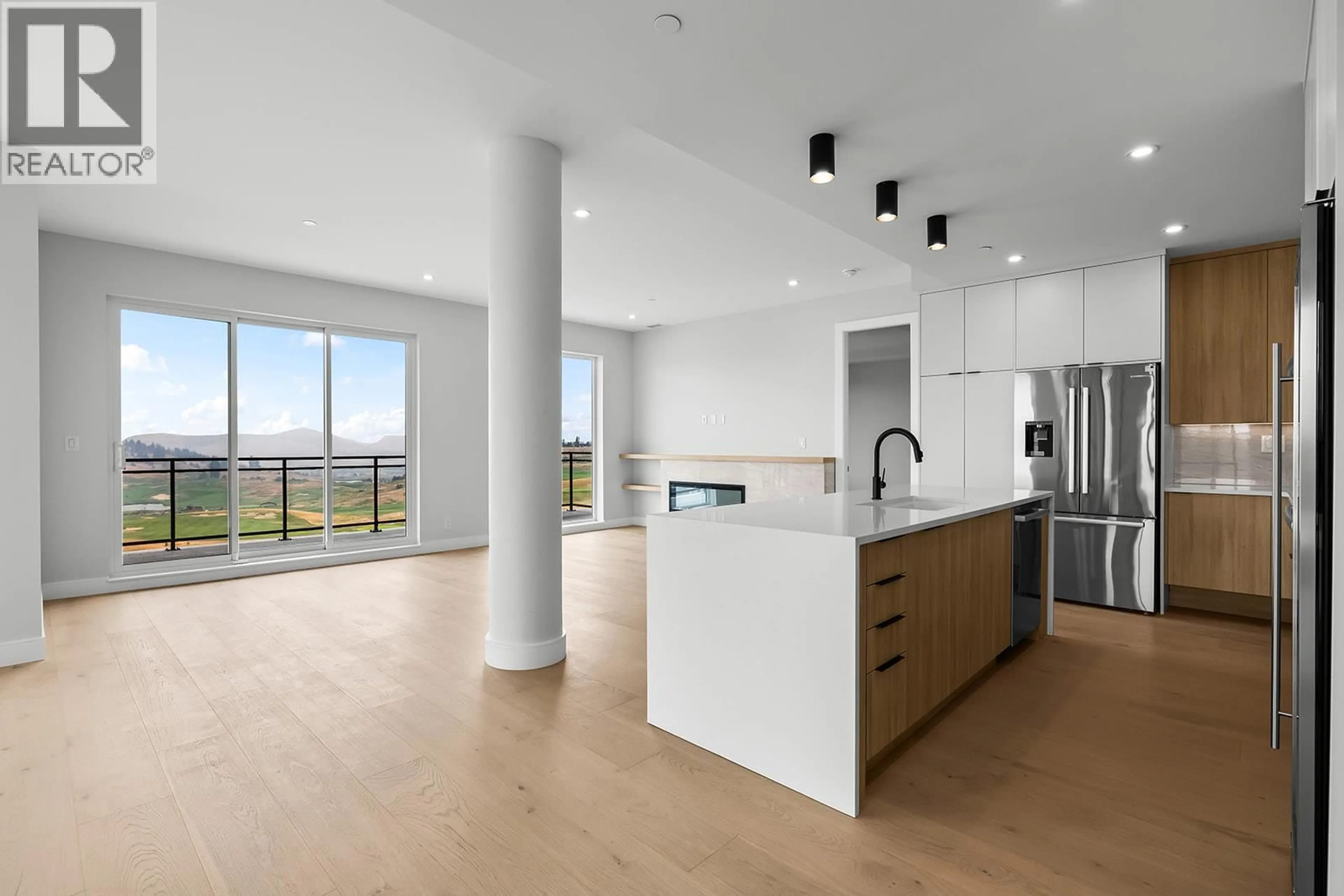 Open concept kitchen, unknown for 502 - 75 PREDATOR RIDGE DRIVE, Vernon British Columbia V1H1G4