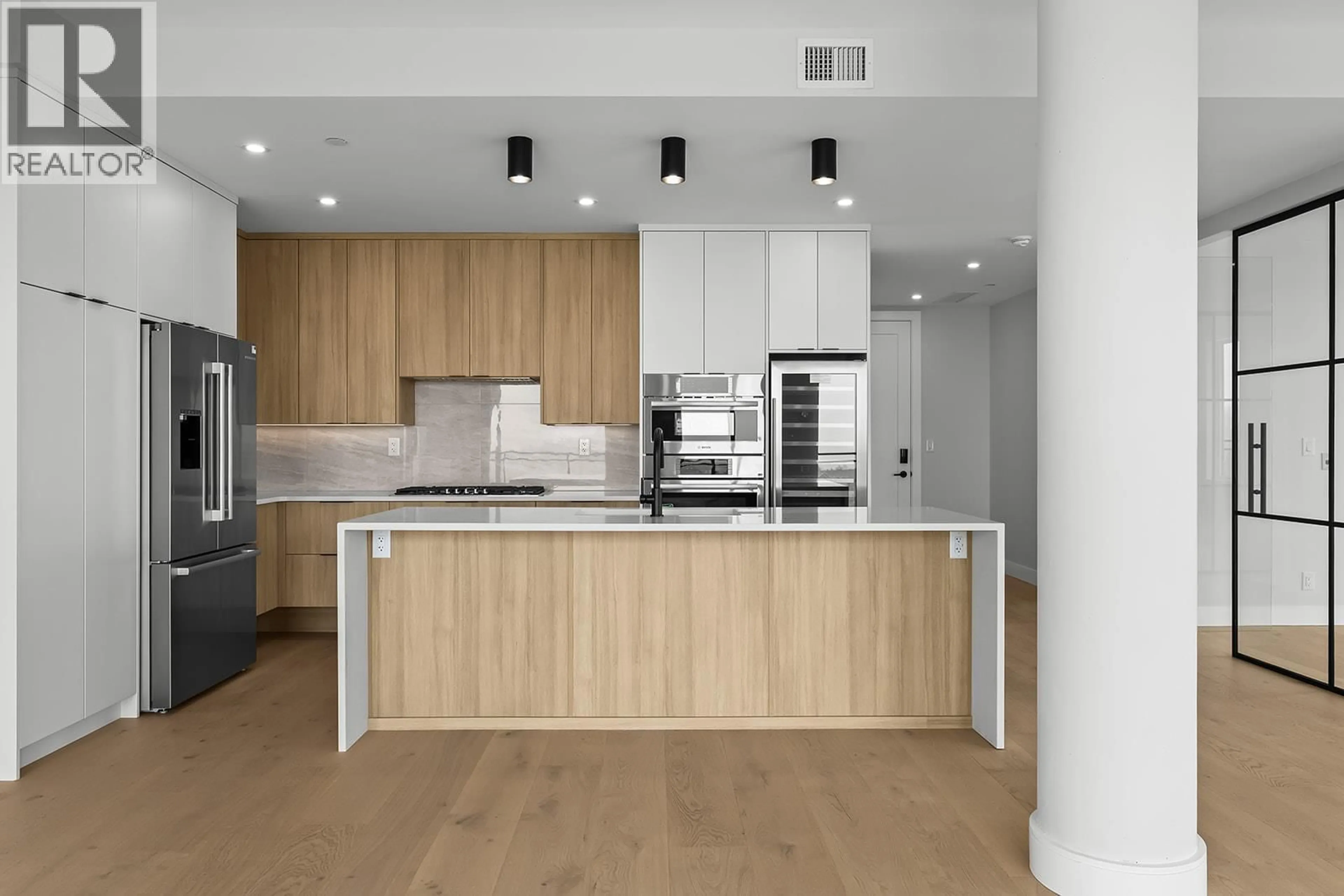 Contemporary kitchen, wood/laminate floor for 502 - 75 PREDATOR RIDGE DRIVE, Vernon British Columbia V1H1G4