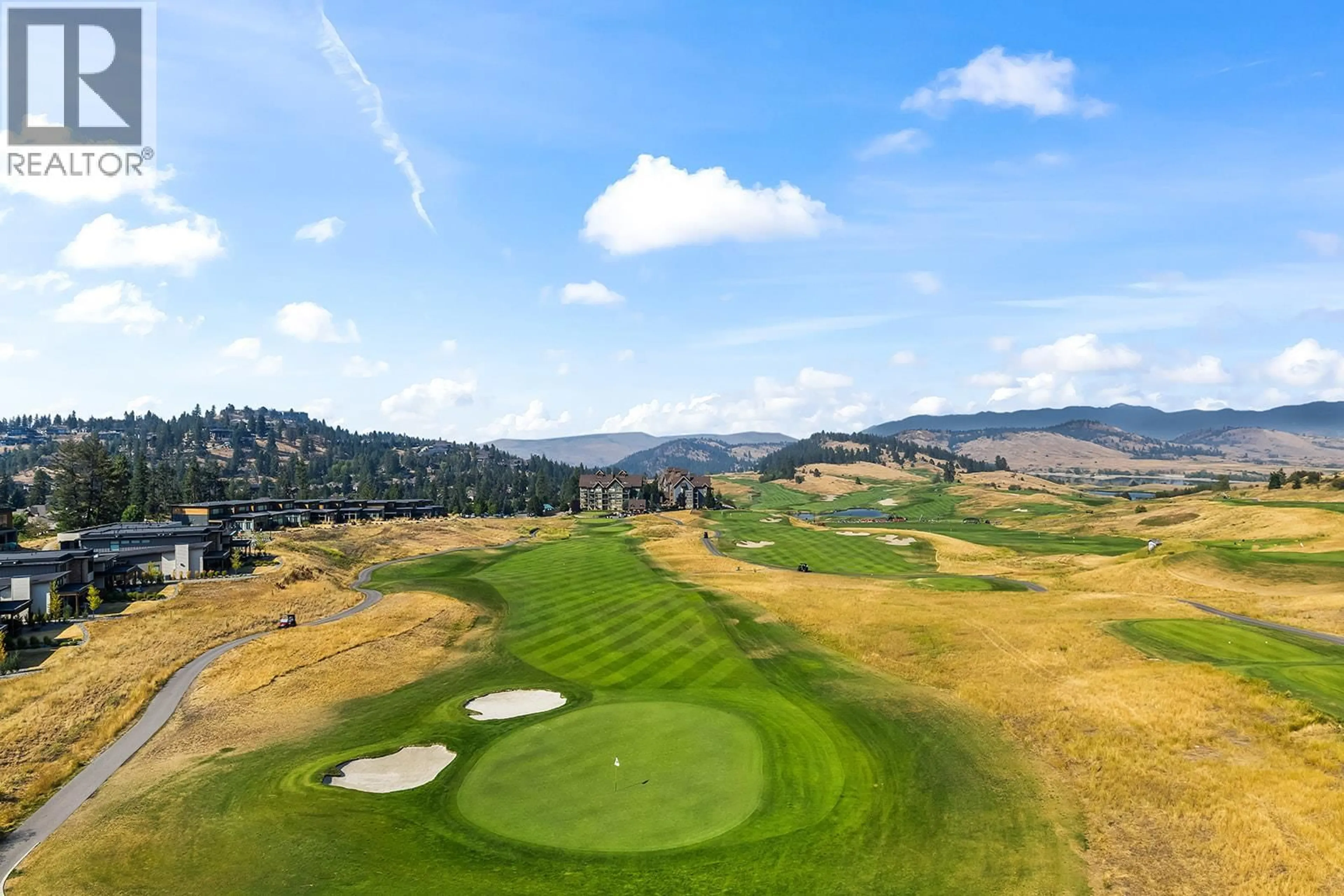 A pic from outside/outdoor area/front of a property/back of a property/a pic from drone, mountain view for 606 - 75 PREDATOR RIDGE DRIVE, Vernon British Columbia V1H1G4