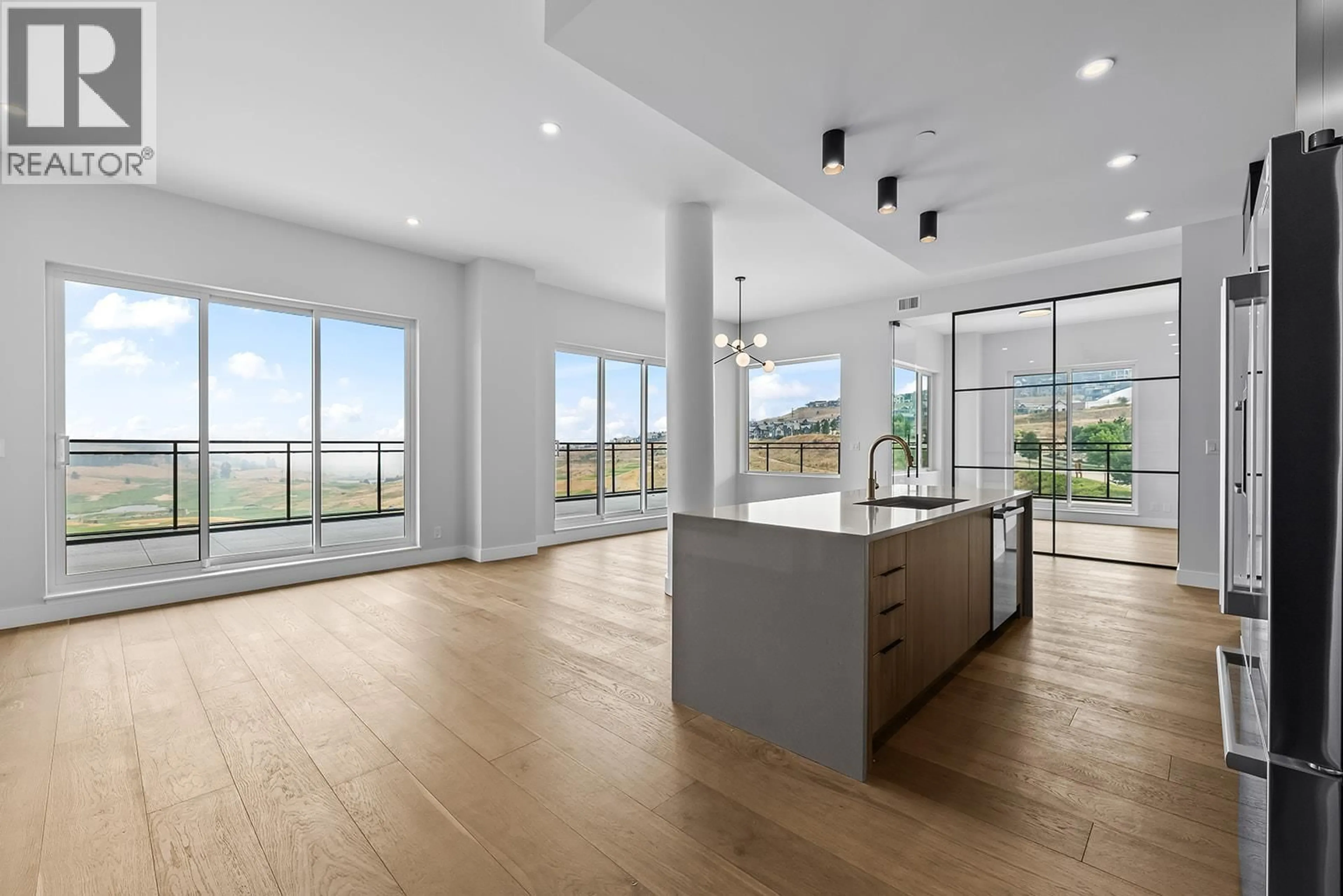 Open concept kitchen, unknown for 606 - 75 PREDATOR RIDGE DRIVE, Vernon British Columbia V1H1G4