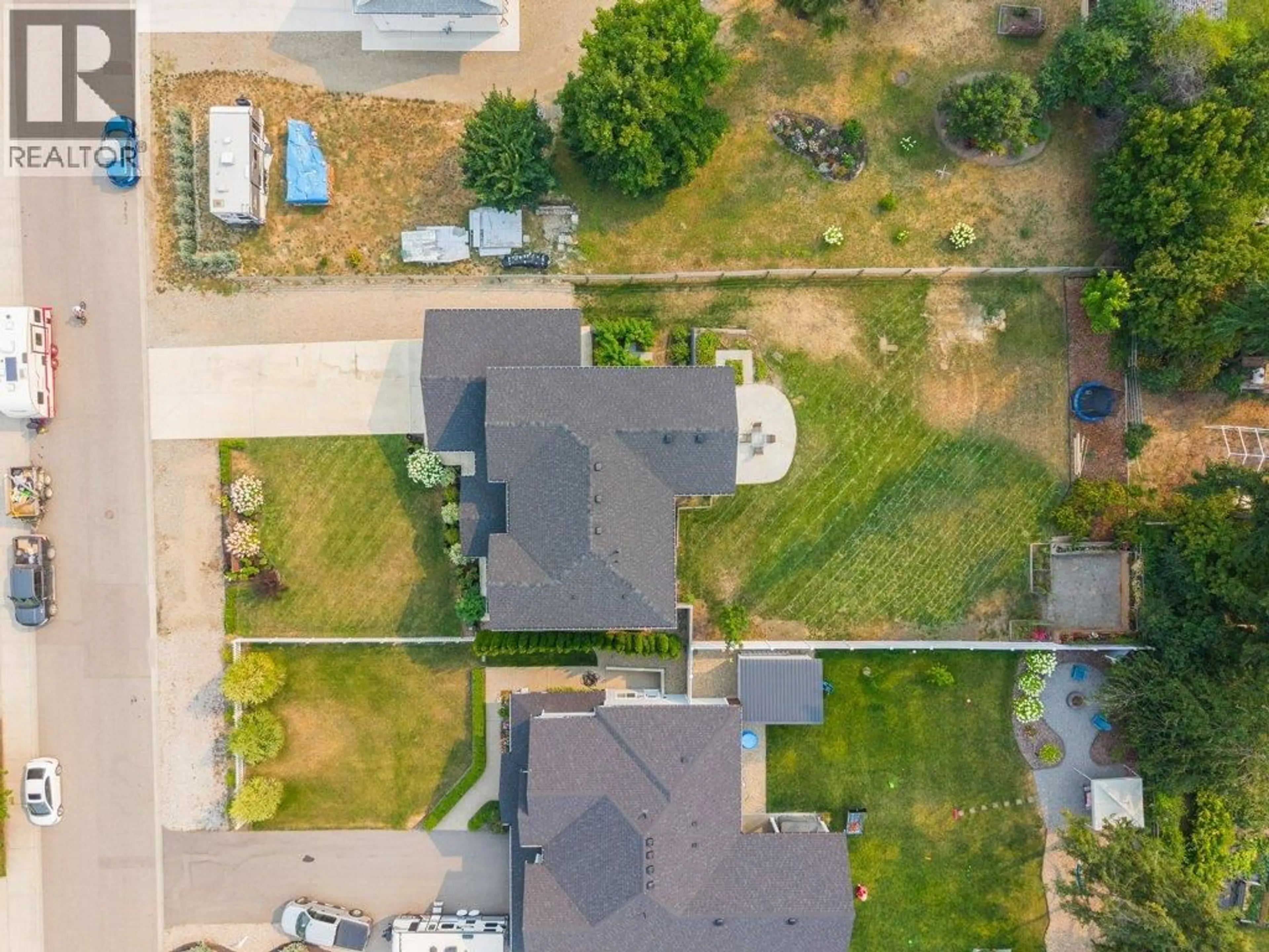 A pic from outside/outdoor area/front of a property/back of a property/a pic from drone, street for 1791 22 STREET NORTHEAST, Salmon Arm British Columbia V1E3M9