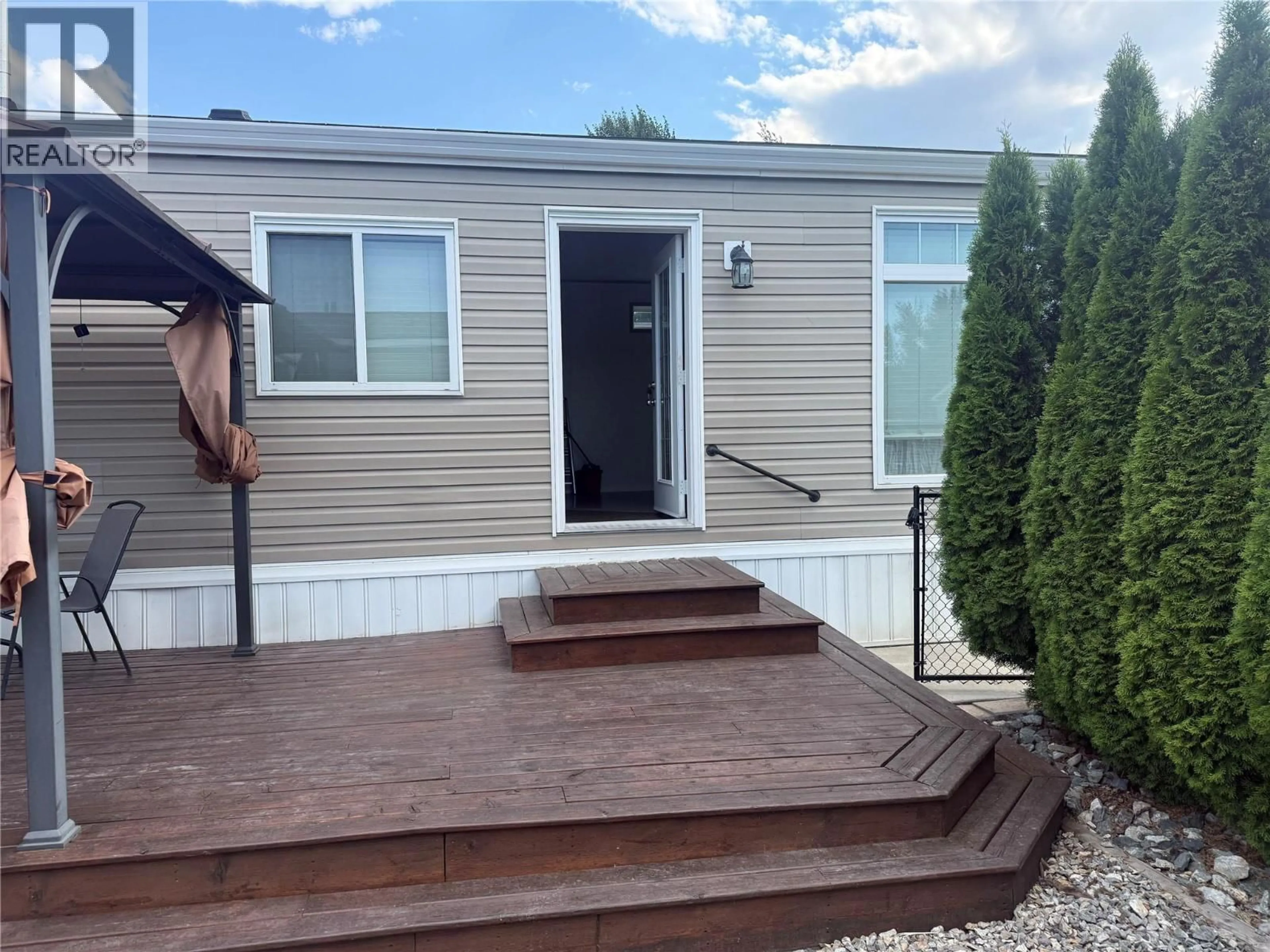 Home with vinyl exterior material, street for 13 - 8945 97 HIGHWAY, Kelowna British Columbia V4V1E8
