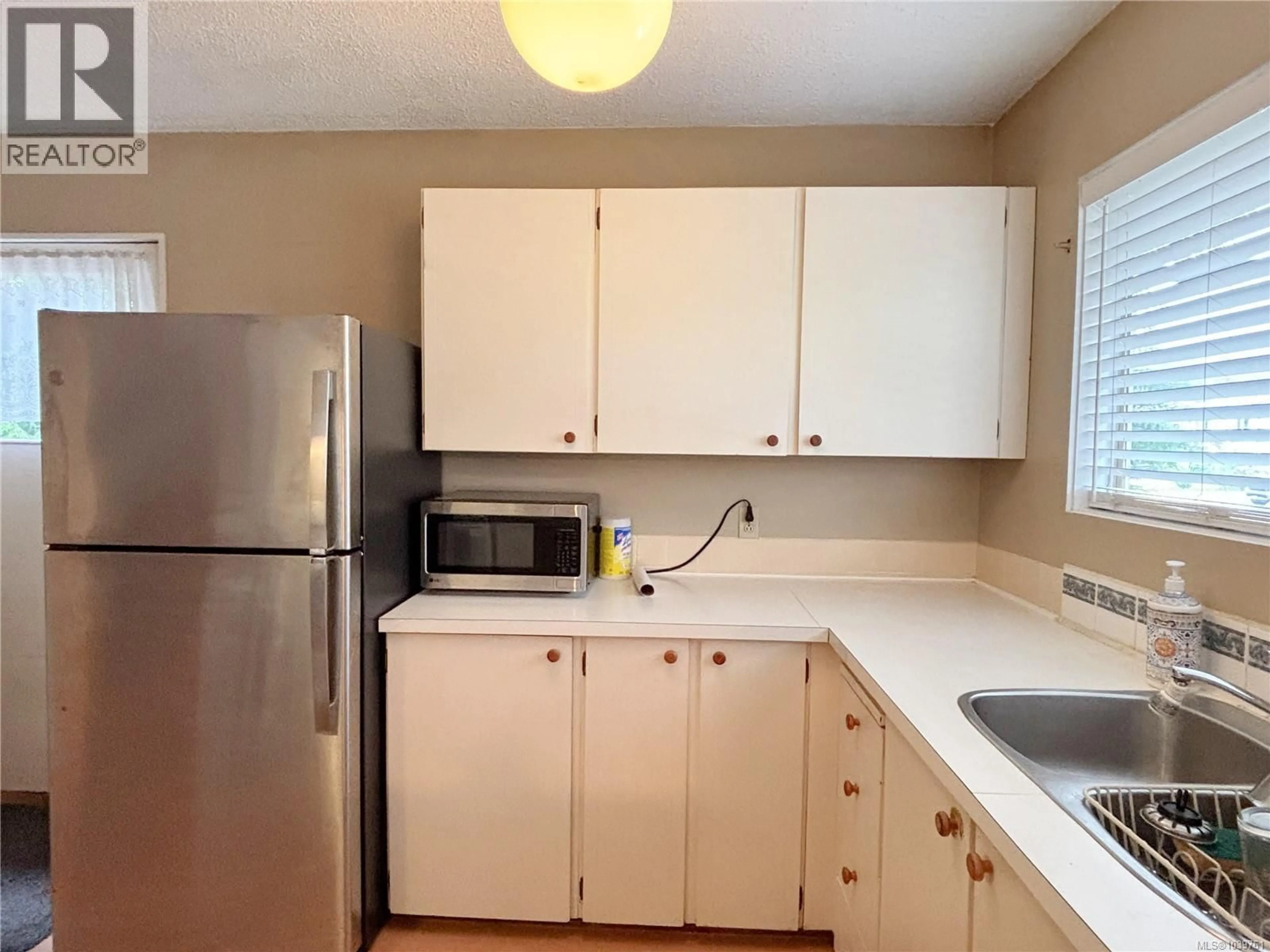 Standard kitchen, wood/laminate floor for 380 ALDER STREET, Gold River British Columbia V0P1G0