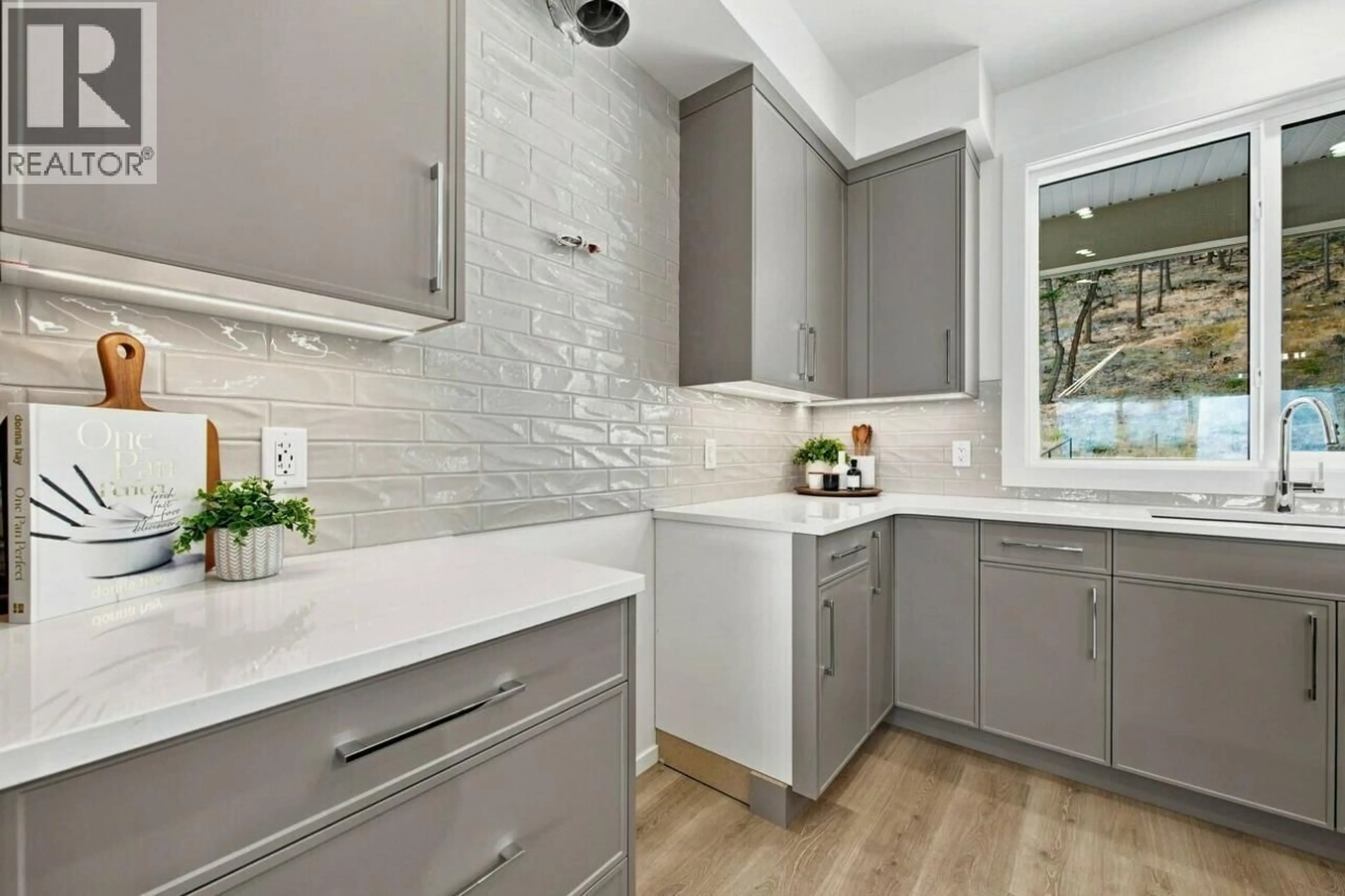 Contemporary kitchen, ceramic/tile floor for 2071 CORTINA DRIVE, Kelowna British Columbia V1P1R3