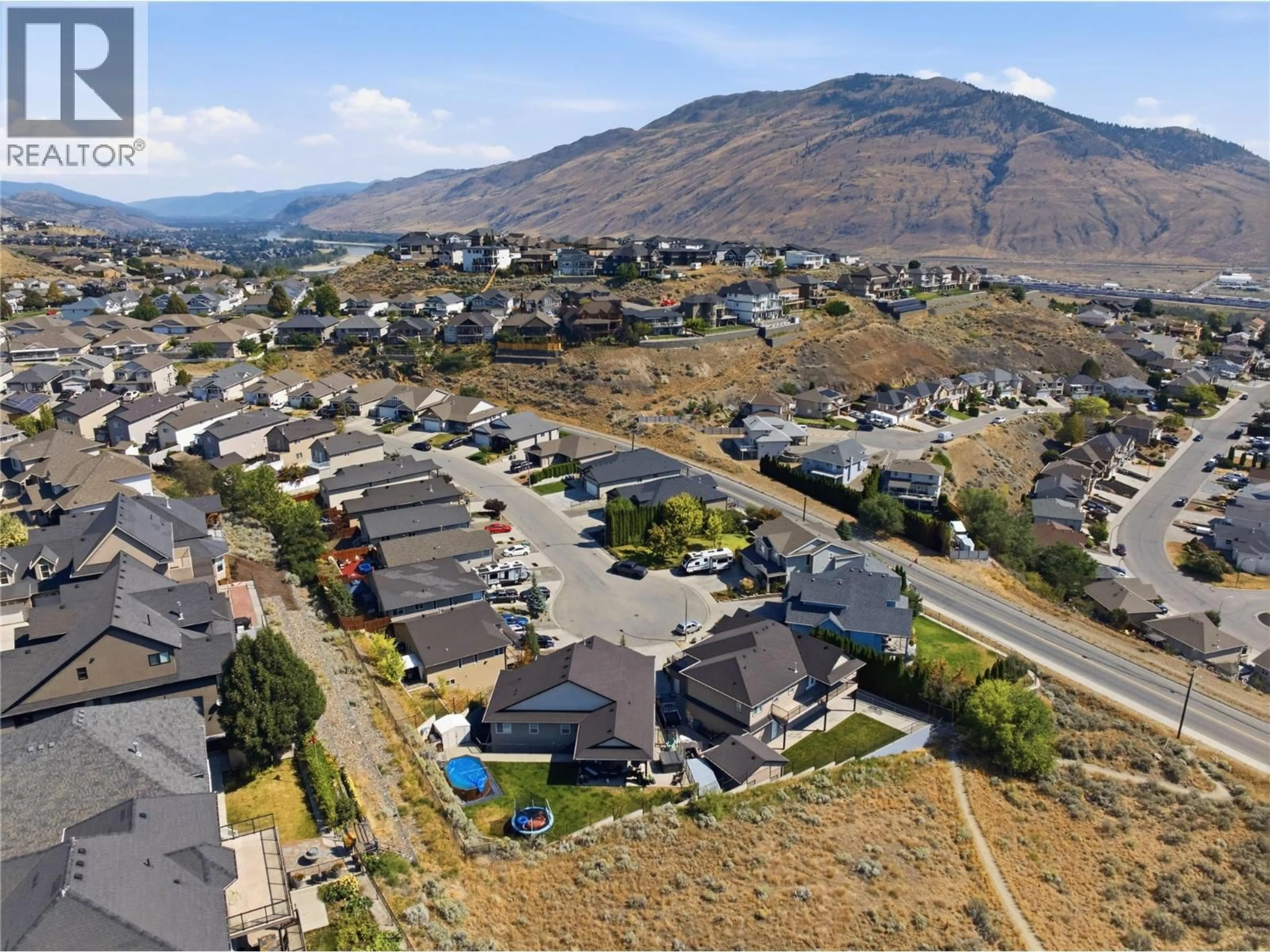 A pic from outside/outdoor area/front of a property/back of a property/a pic from drone, mountain view for 1887 GROUSE COURT, Kamloops British Columbia V2B8S9