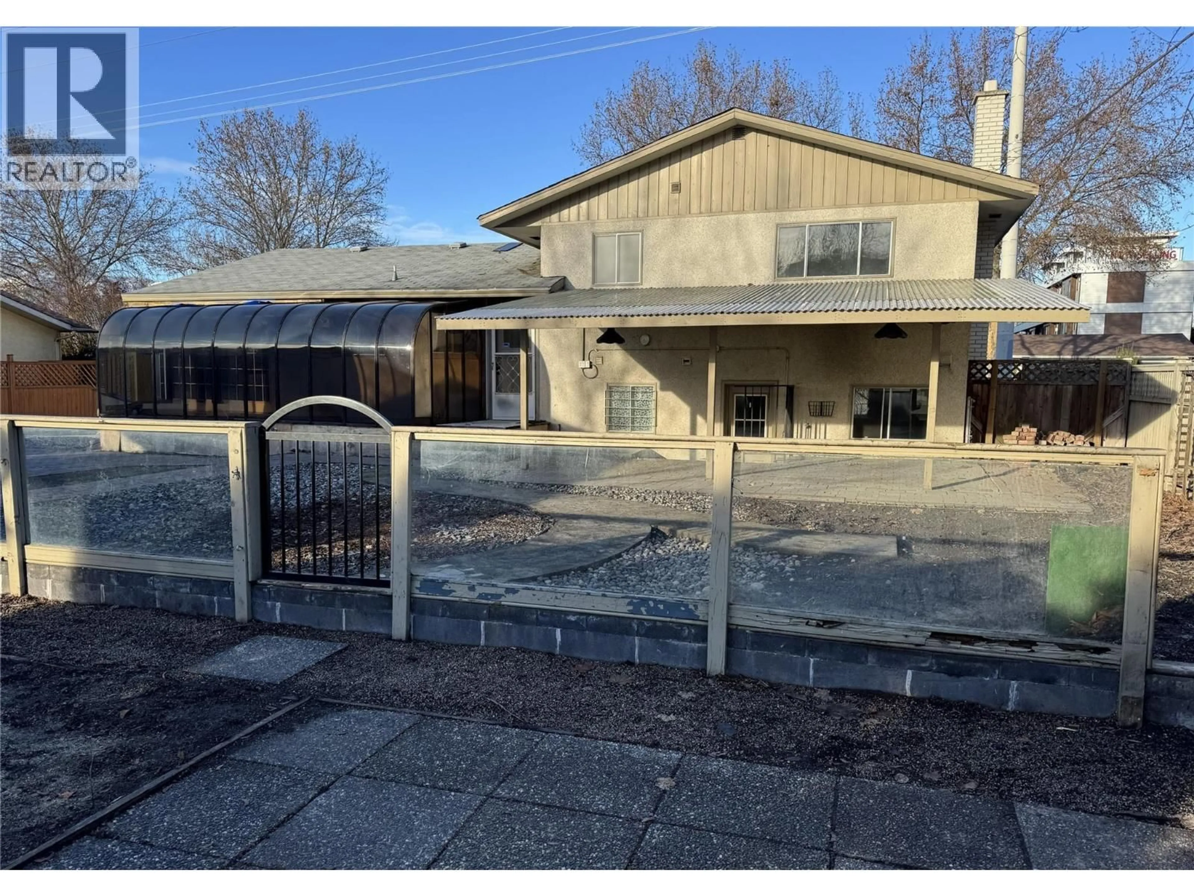 A pic from outside/outdoor area/front of a property/back of a property/a pic from drone, street for 1441 SPRINGFIELD ROAD, Kelowna British Columbia V1Y5V2