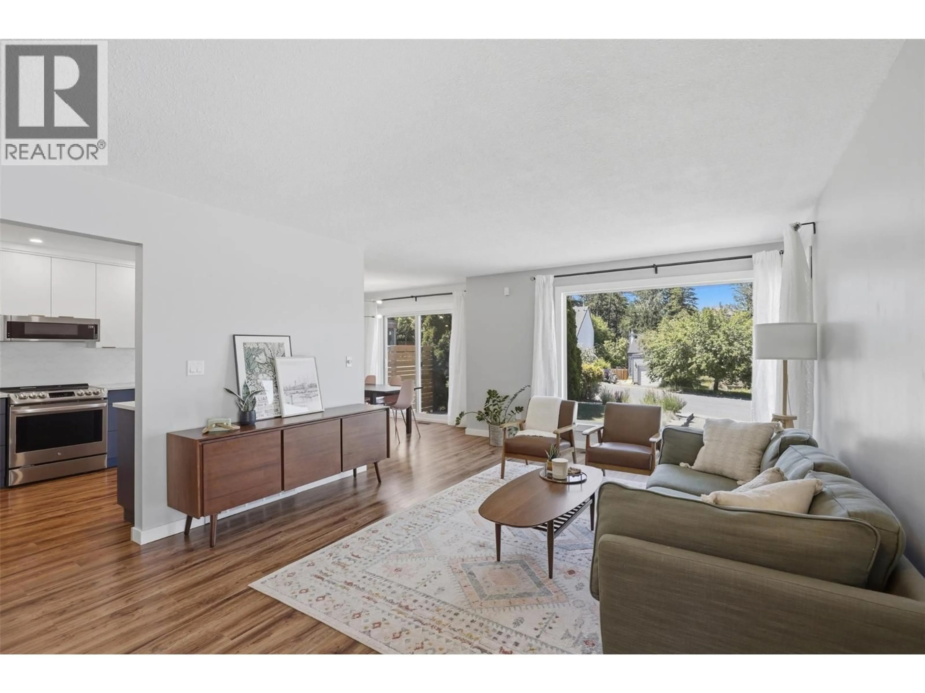 Living room with furniture, wood/laminate floor for 575 GLENEAGLES DRIVE, Kamloops British Columbia V2E1X1