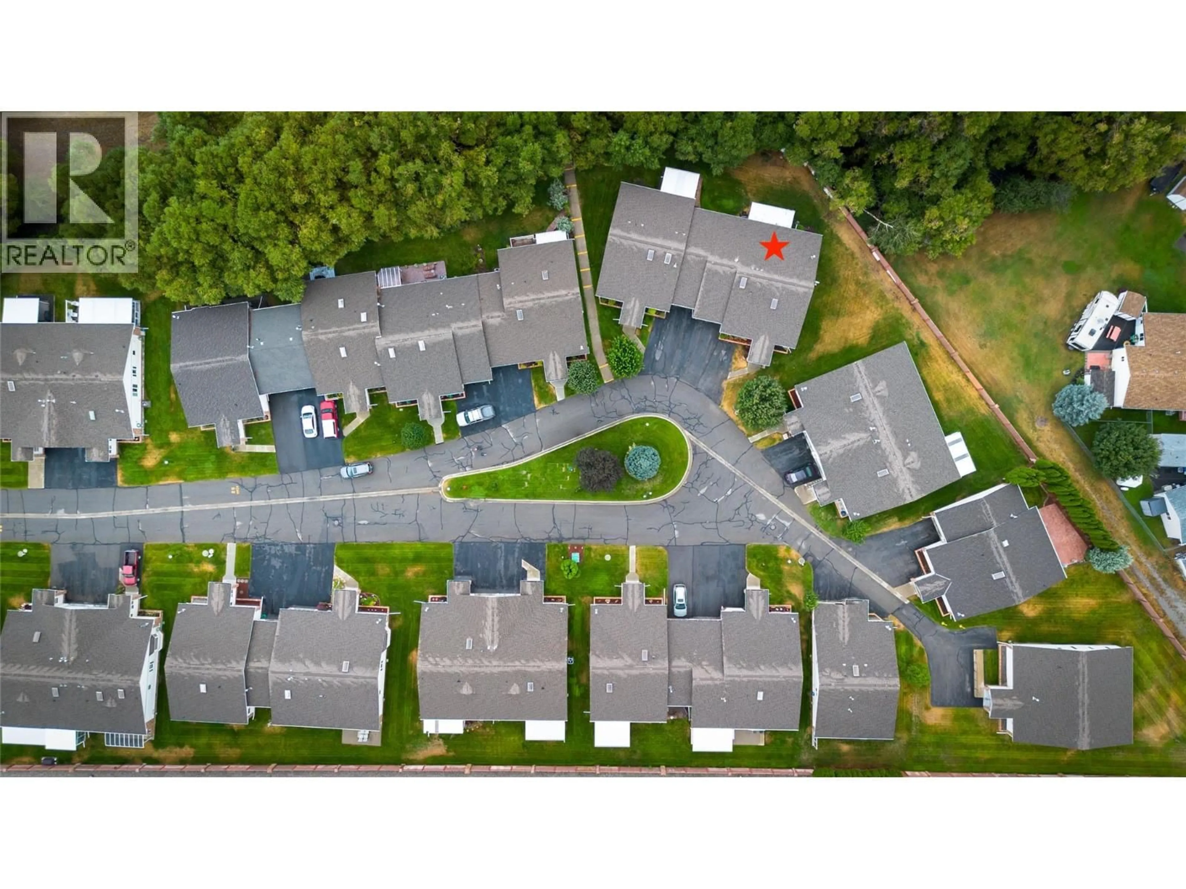 A pic from outside/outdoor area/front of a property/back of a property/a pic from drone, street for 46 - 2025 KOKANEE DRIVE, Cranbrook British Columbia V1C6J2