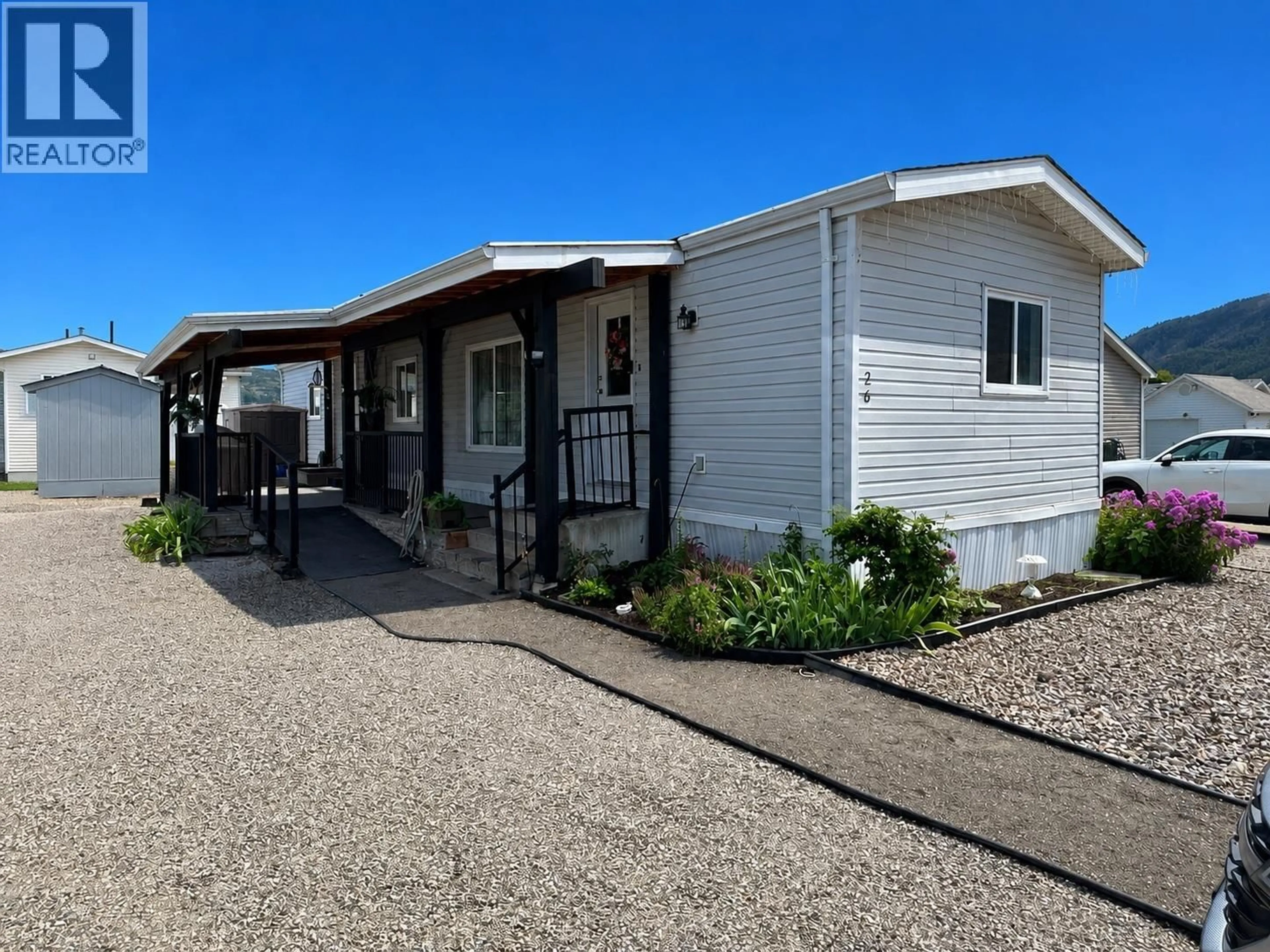 Home with vinyl exterior material, street for 26 - 12560 WESTSIDE ROAD, Vernon British Columbia V1H1S9