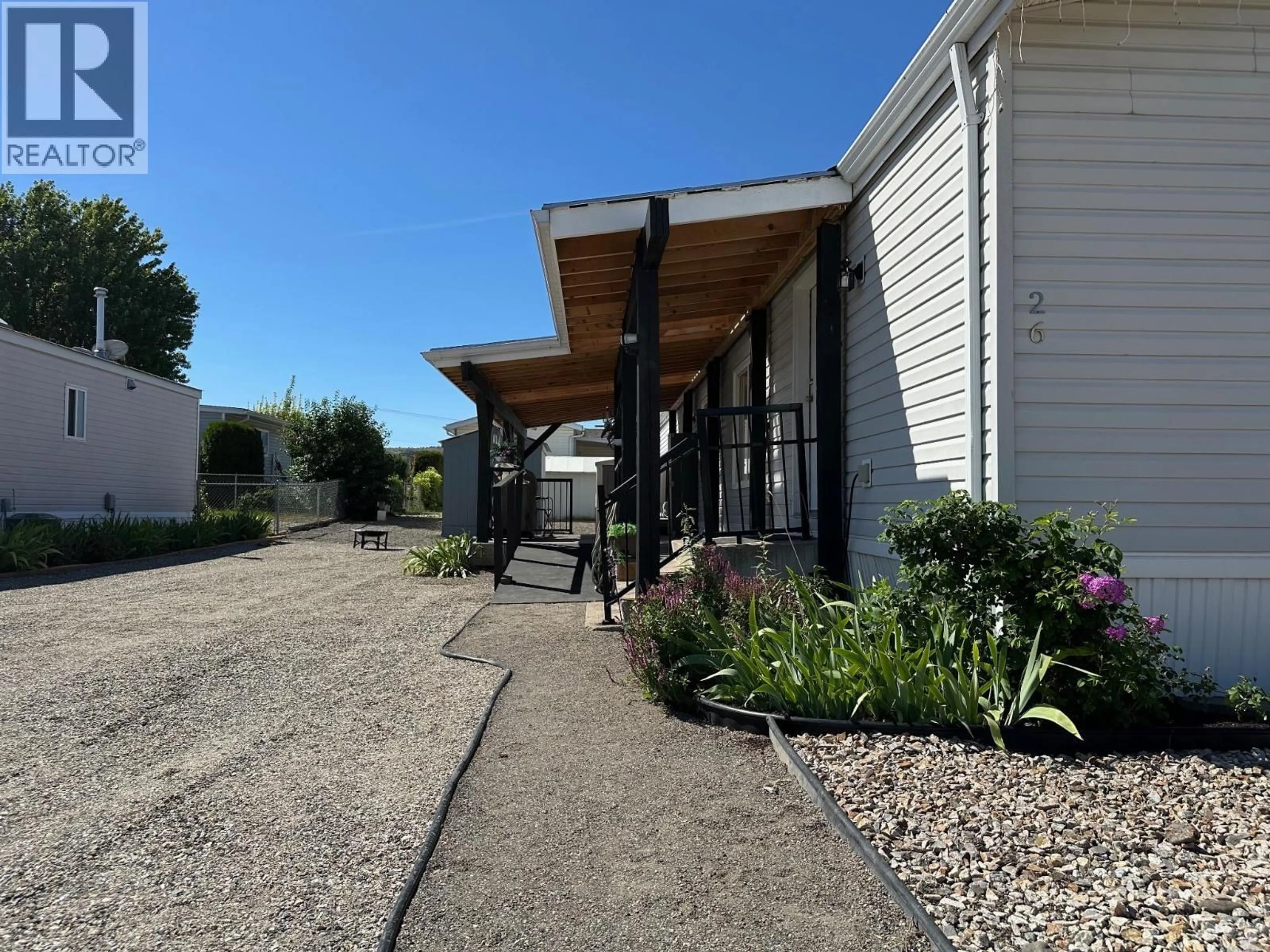 A pic from outside/outdoor area/front of a property/back of a property/a pic from drone, street for 26 - 12560 WESTSIDE ROAD, Vernon British Columbia V1H1S9