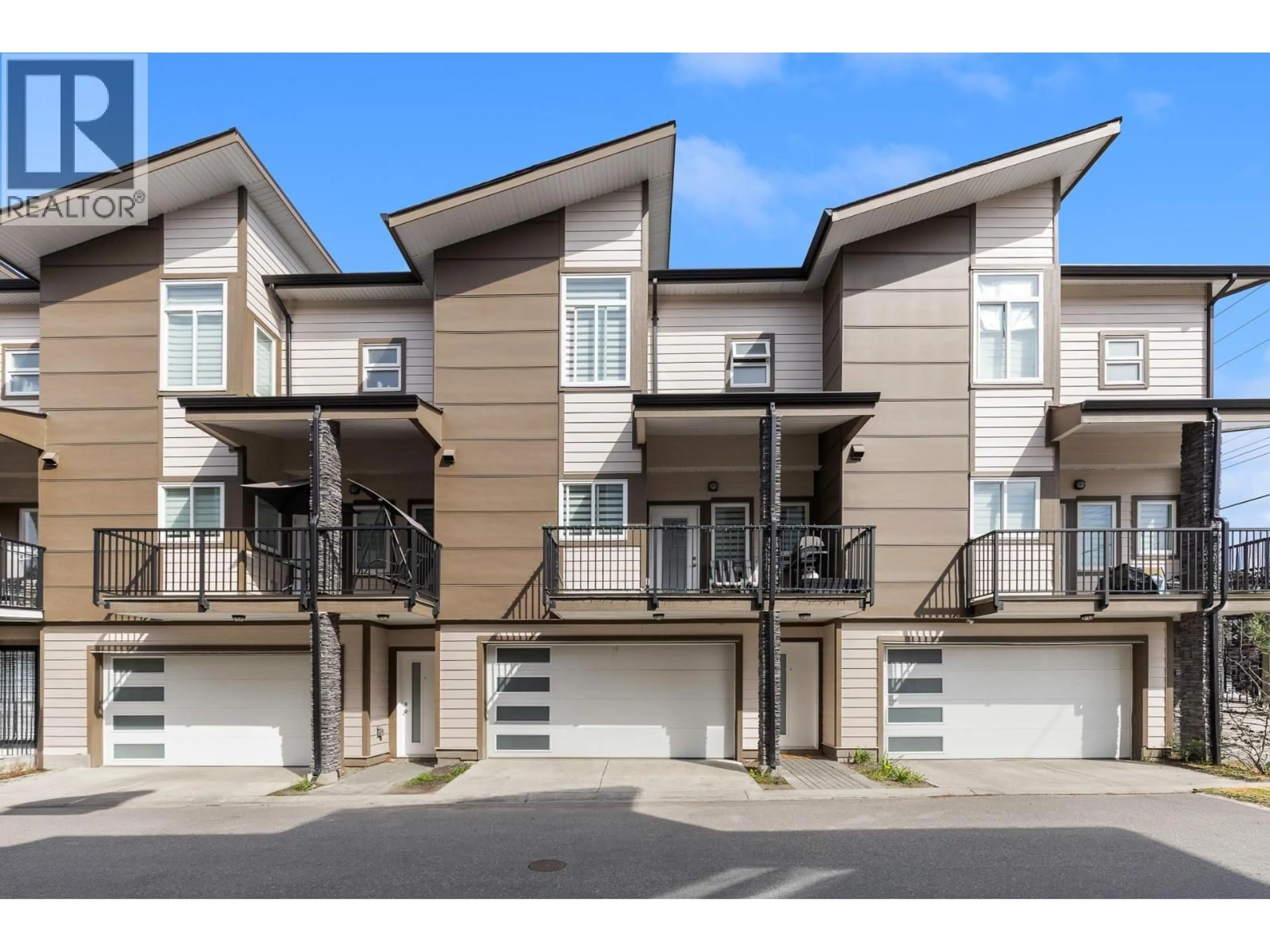Home with vinyl exterior material, street for 2 - 1354 RUTLAND ROAD NORTH, Kelowna British Columbia V1X4Z3