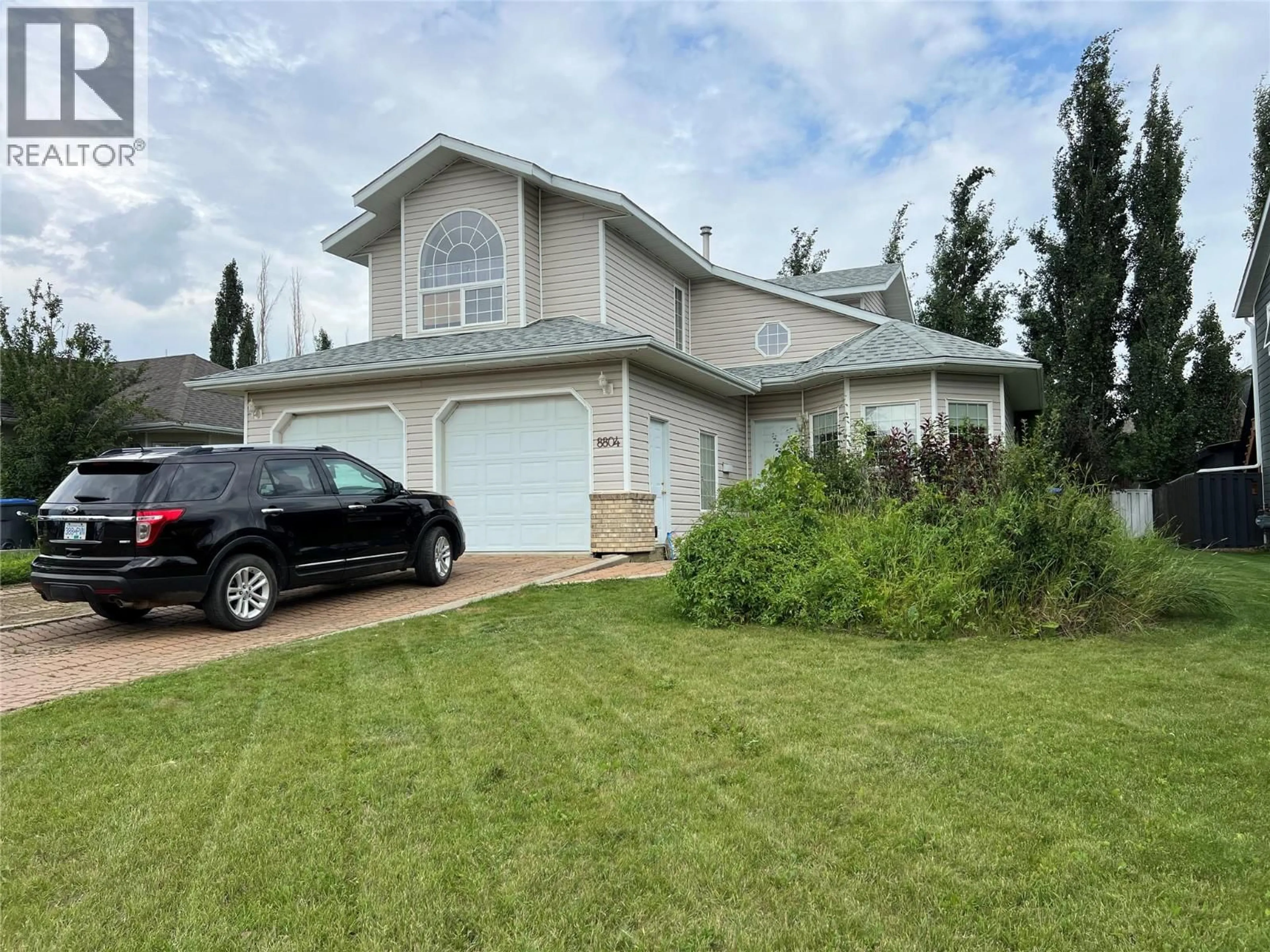 Home with vinyl exterior material, street for 8804 20 STREET, Dawson Creek British Columbia V1G4S3
