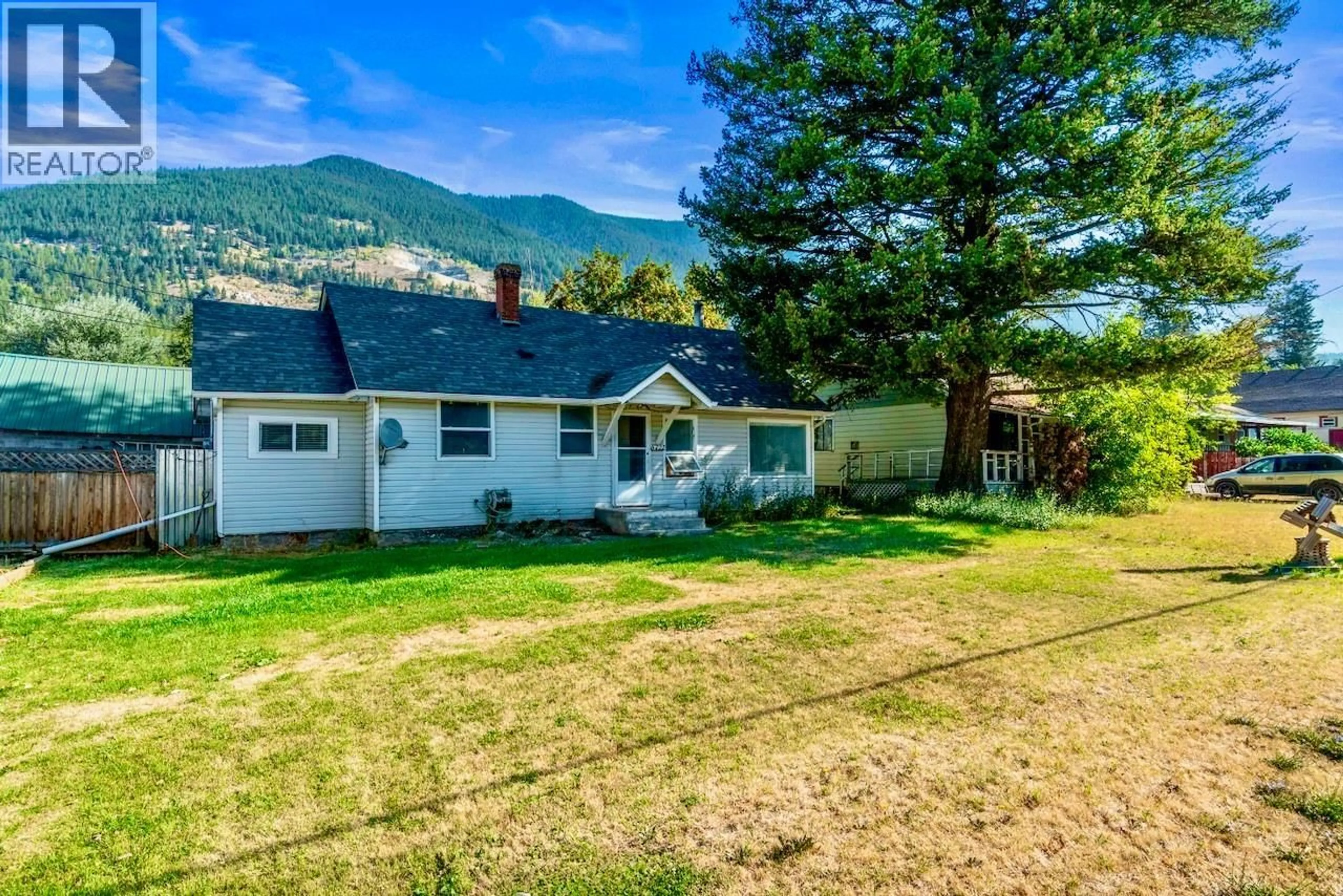 A pic from outside/outdoor area/front of a property/back of a property/a pic from drone, mountain view for 5722 97 HIGHWAY NORTH, Falkland British Columbia V0E1W0