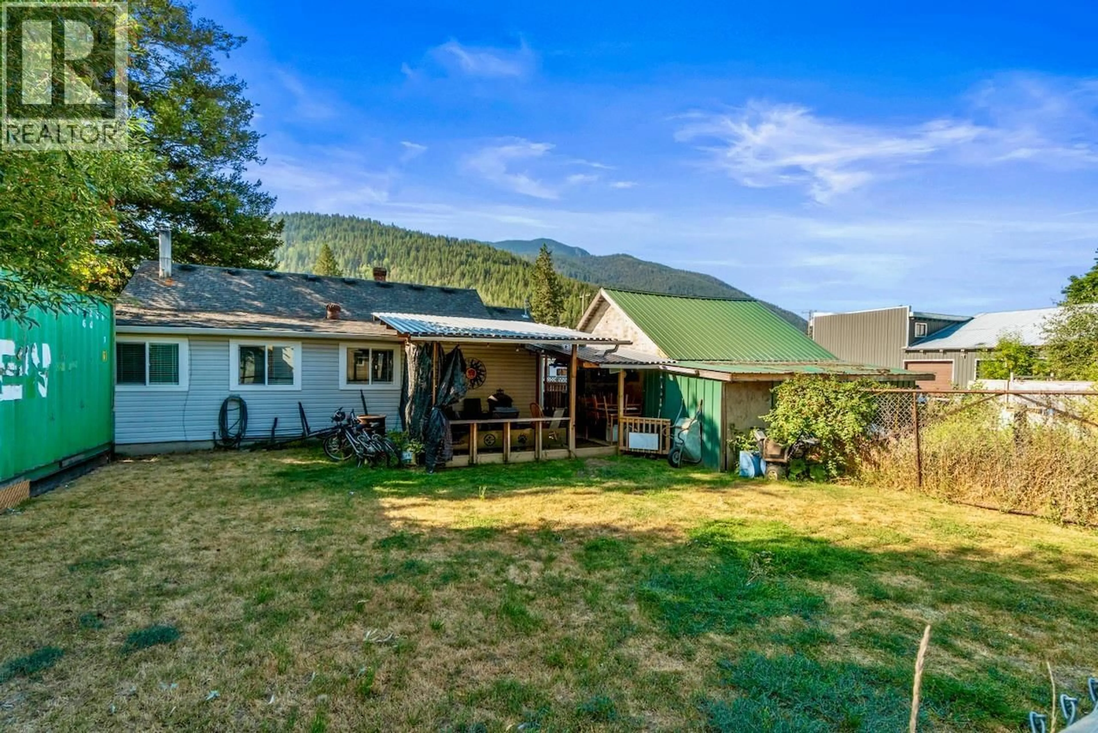 A pic from outside/outdoor area/front of a property/back of a property/a pic from drone, mountain view for 5722 97 HIGHWAY NORTH, Falkland British Columbia V0E1W0