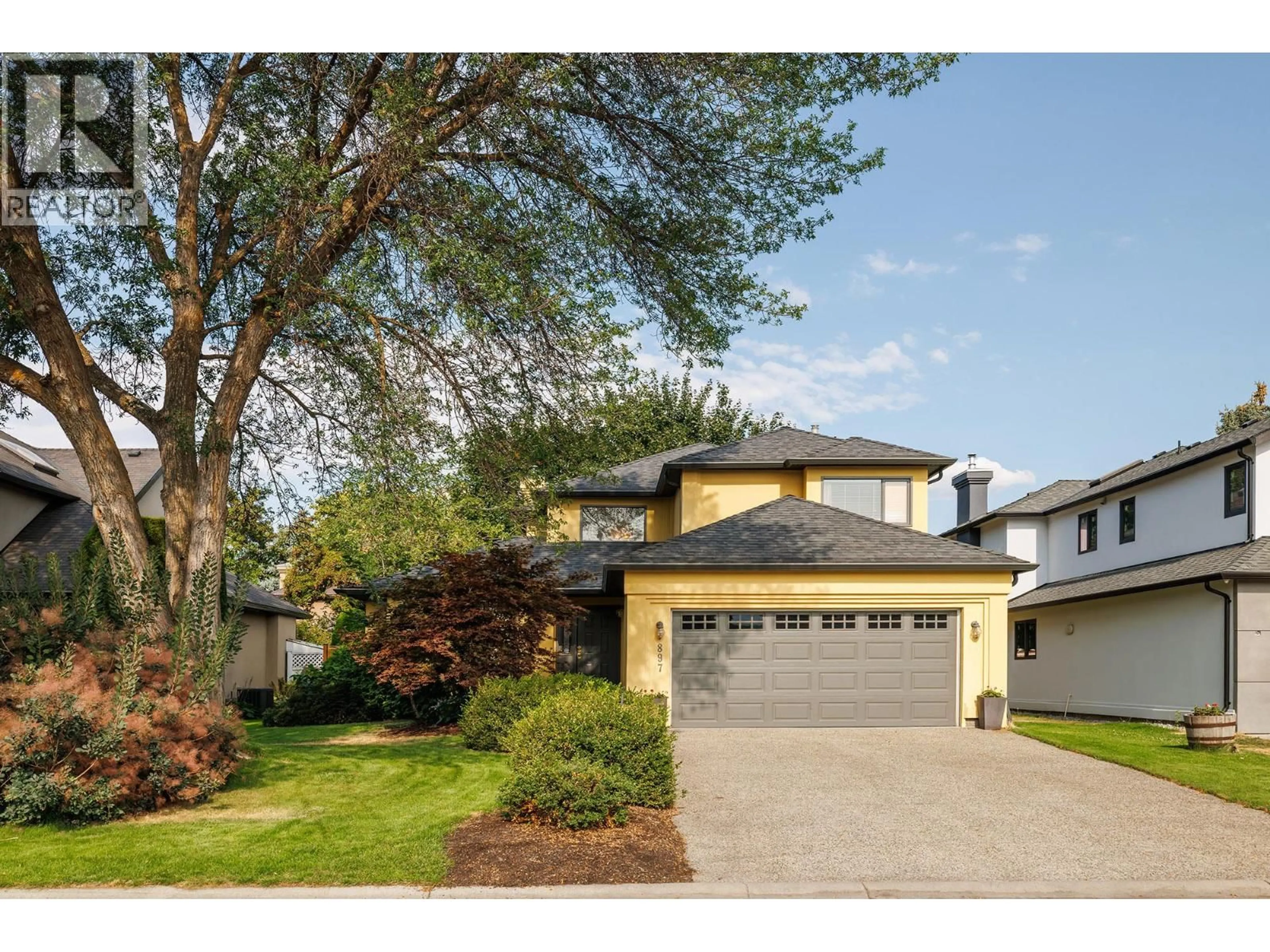 Home with vinyl exterior material, street for 897 MISSION SPRINGS CRESCENT, Kelowna British Columbia V1W3L9