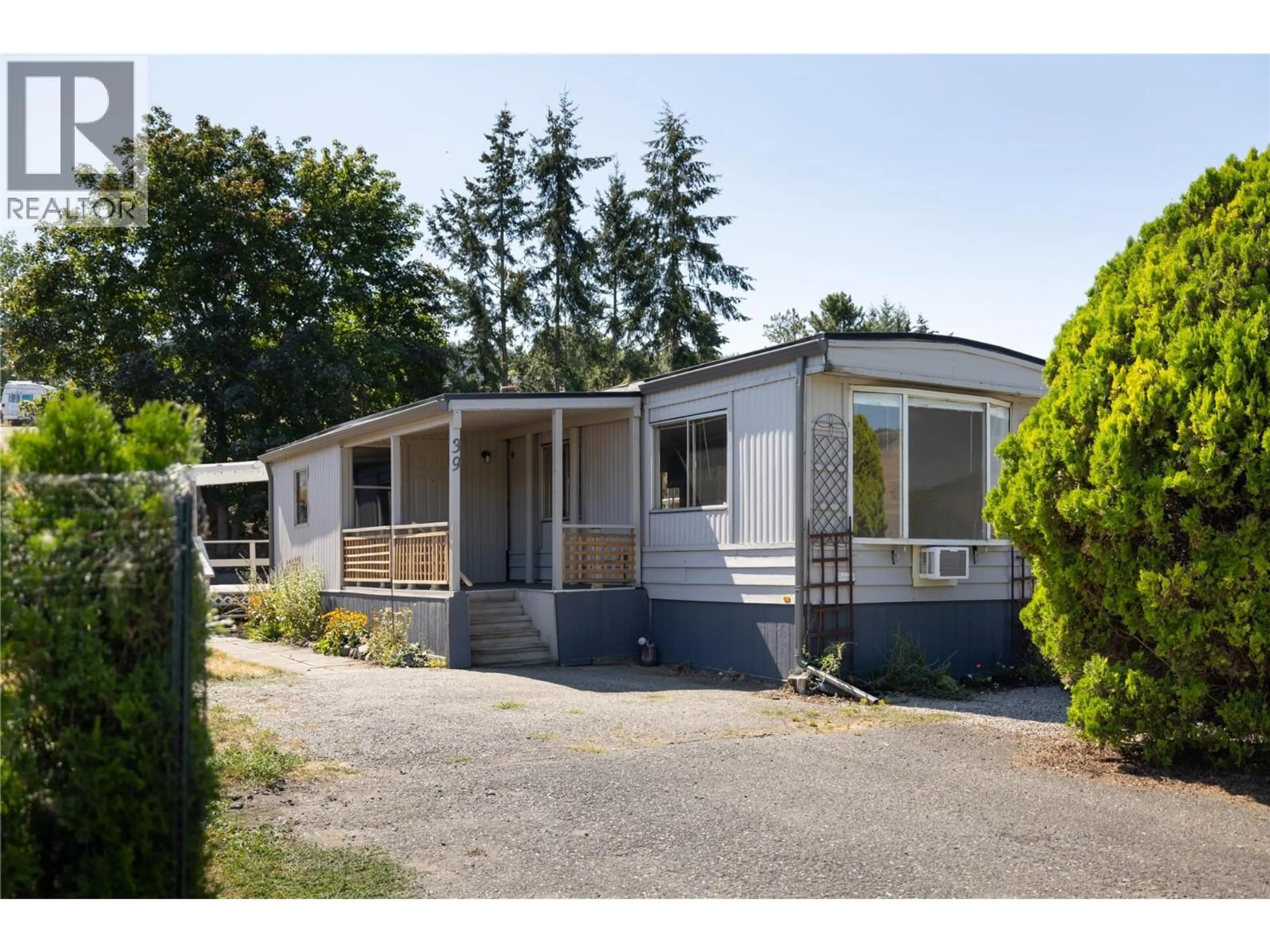 Home with vinyl exterior material, street for 39 - 6902 OKANAGAN LANDING ROAD, Vernon British Columbia V1H1X4