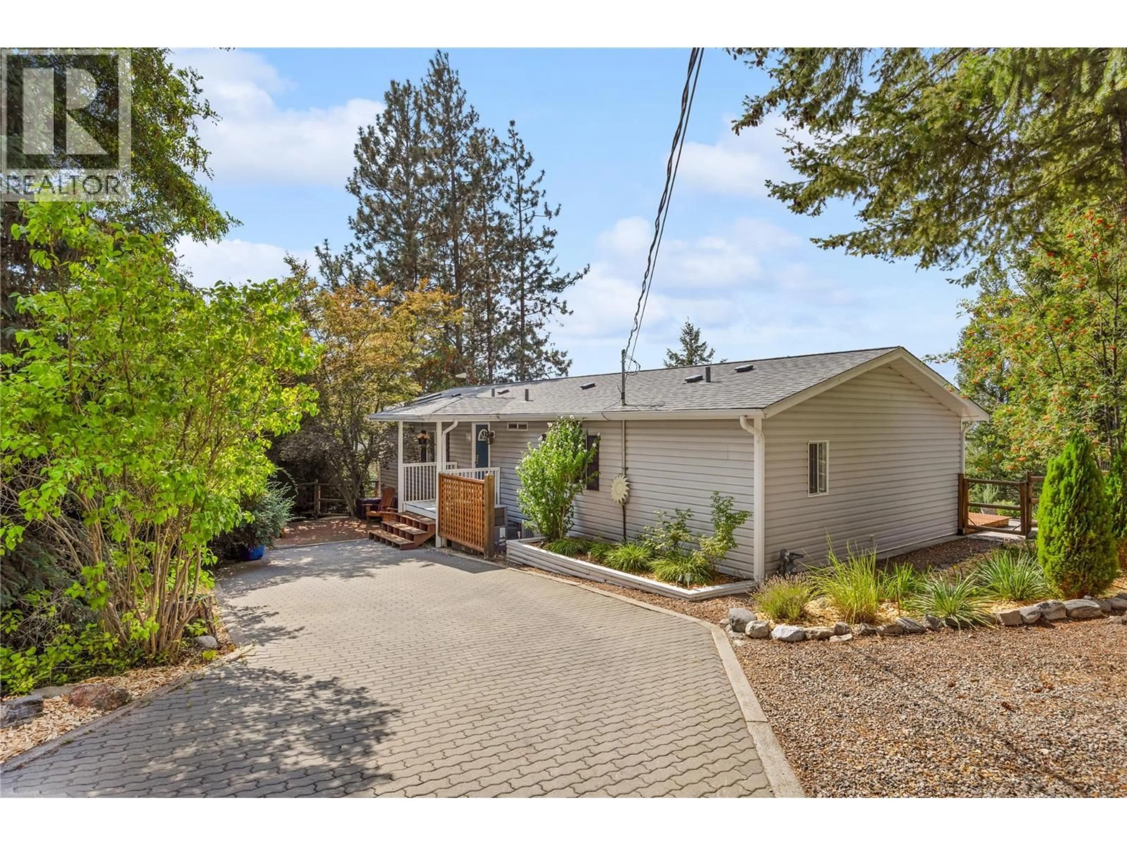 A pic from outside/outdoor area/front of a property/back of a property/a pic from drone, street for 3115 JUNIPER DRIVE, Naramata British Columbia V0H1N1