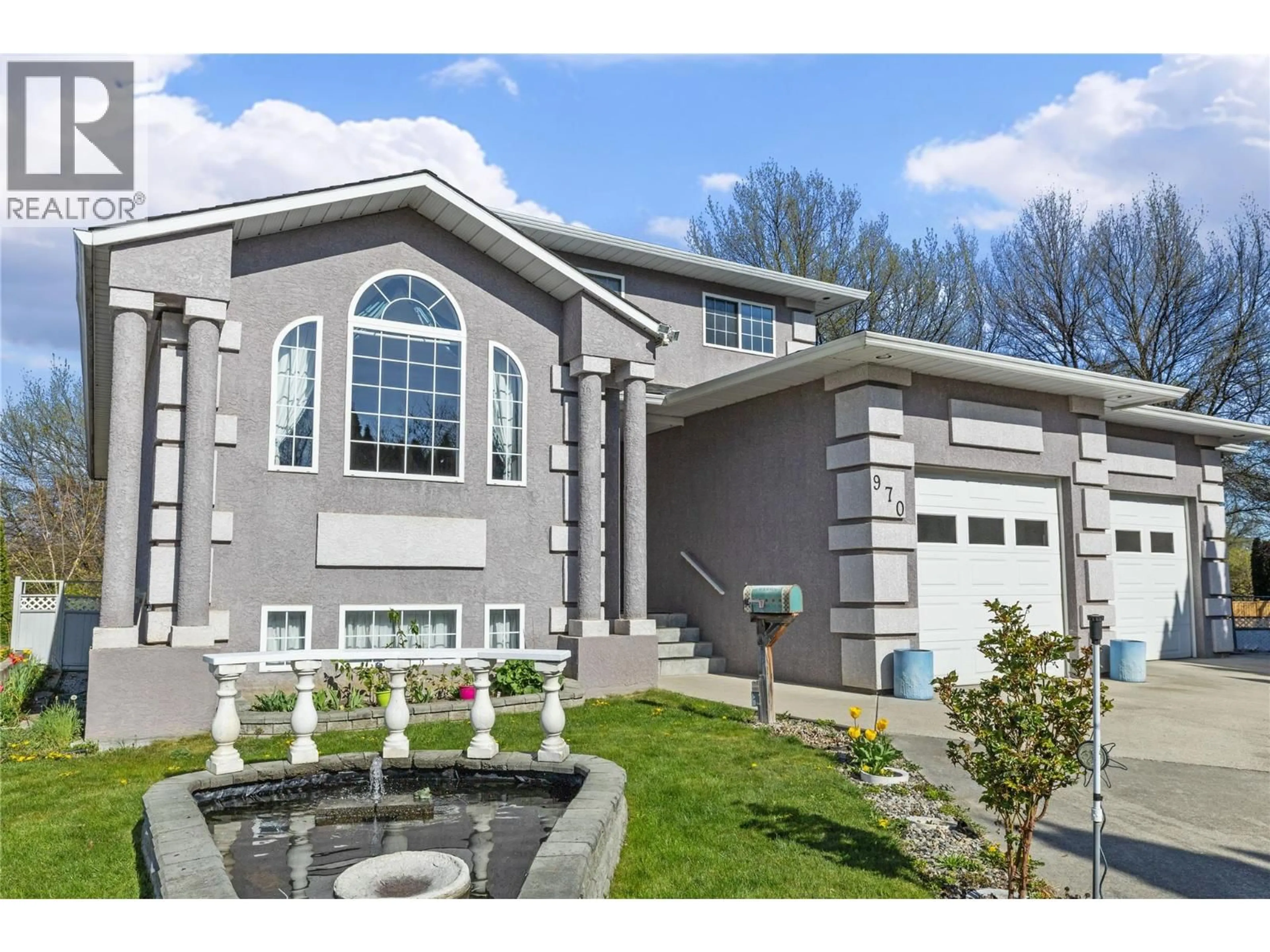 Home with vinyl exterior material, street for 970 MAYGARD ROAD, Kelowna British Columbia V1X5X1
