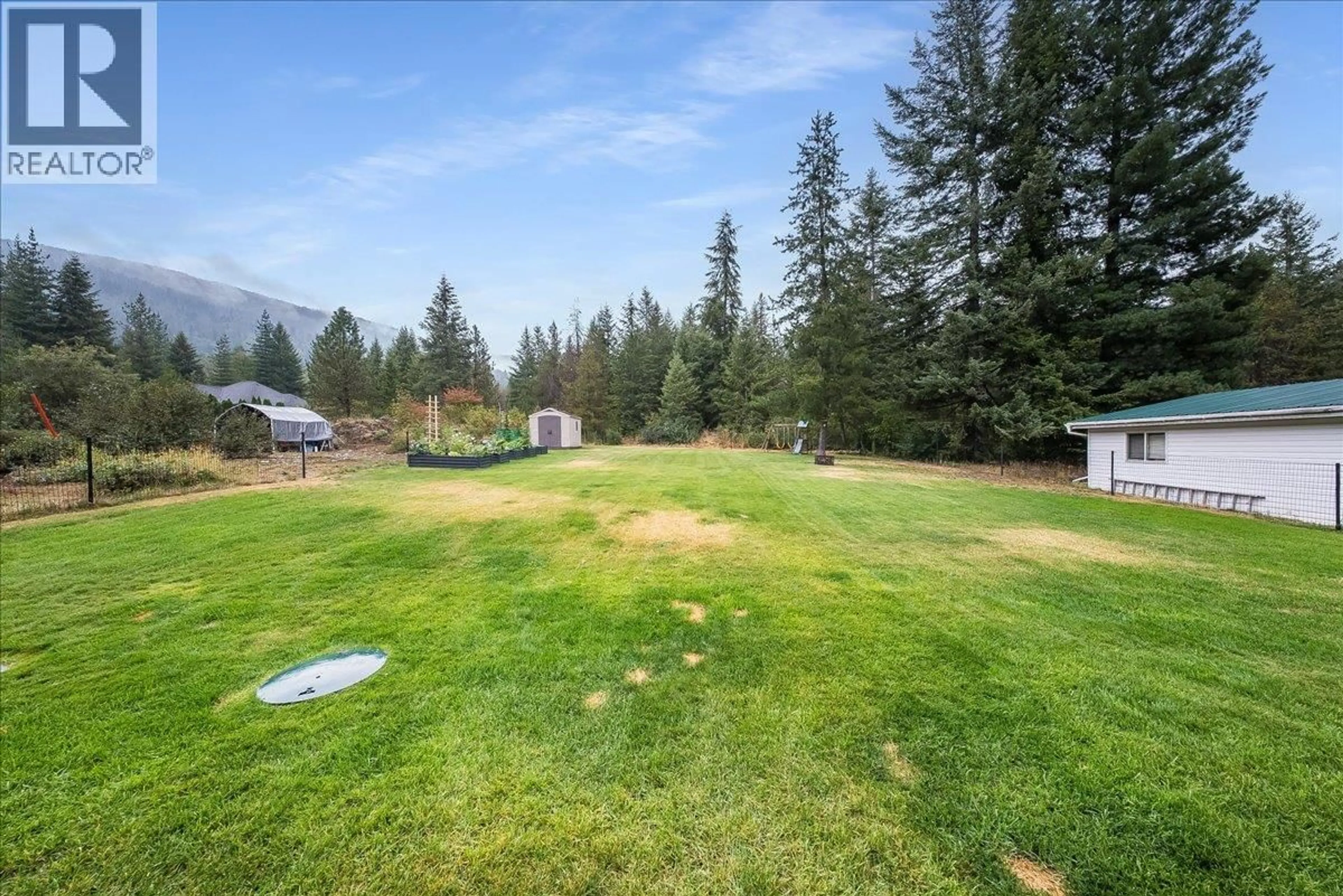 A pic from outside/outdoor area/front of a property/back of a property/a pic from drone, mountain view for 1065 LOWER CHINA CREEK ROAD, Castlegar British Columbia V0G1G0