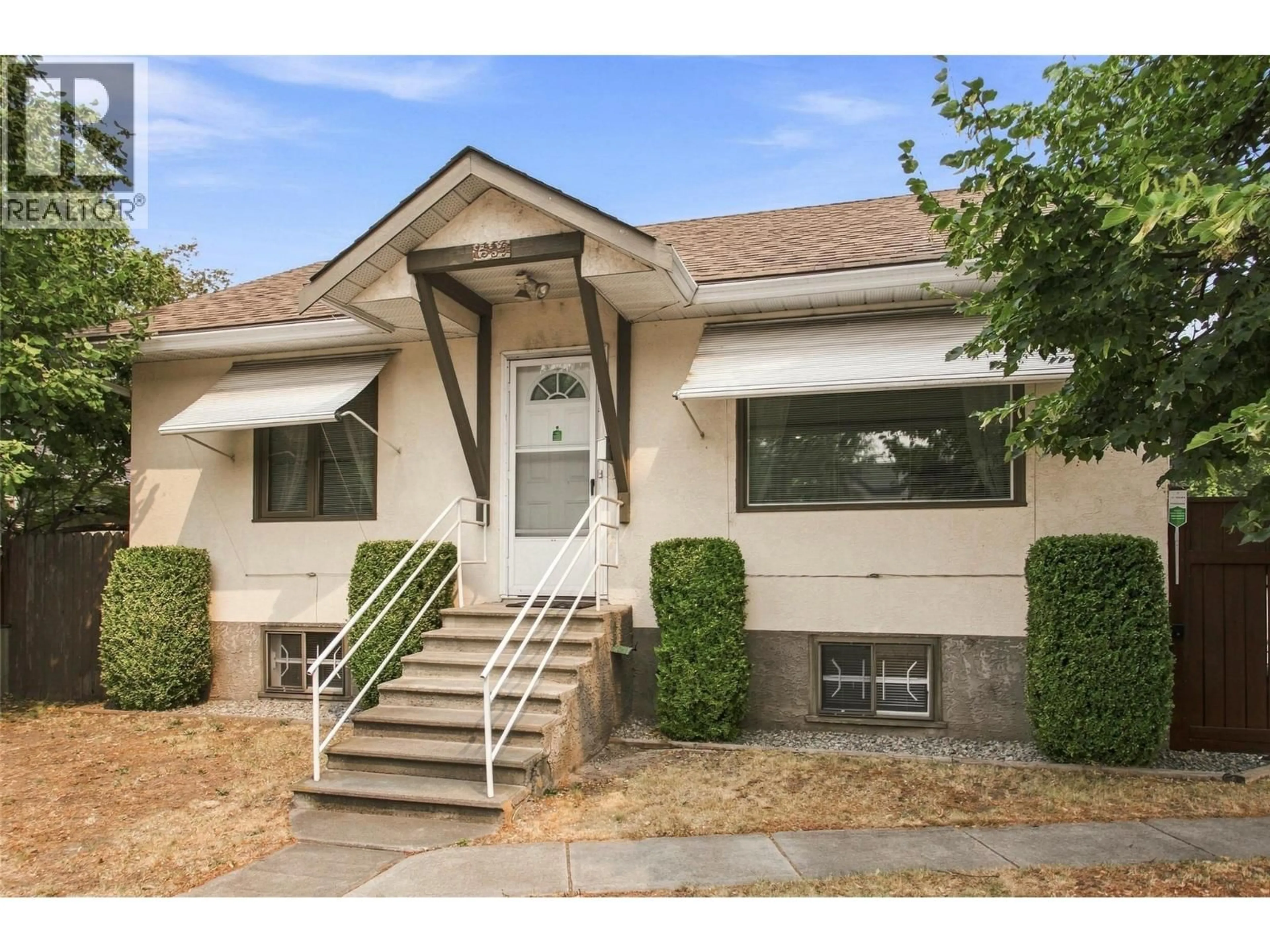 Home with vinyl exterior material, street for 1339 RICHTER STREET, Kelowna British Columbia V1Y2L5