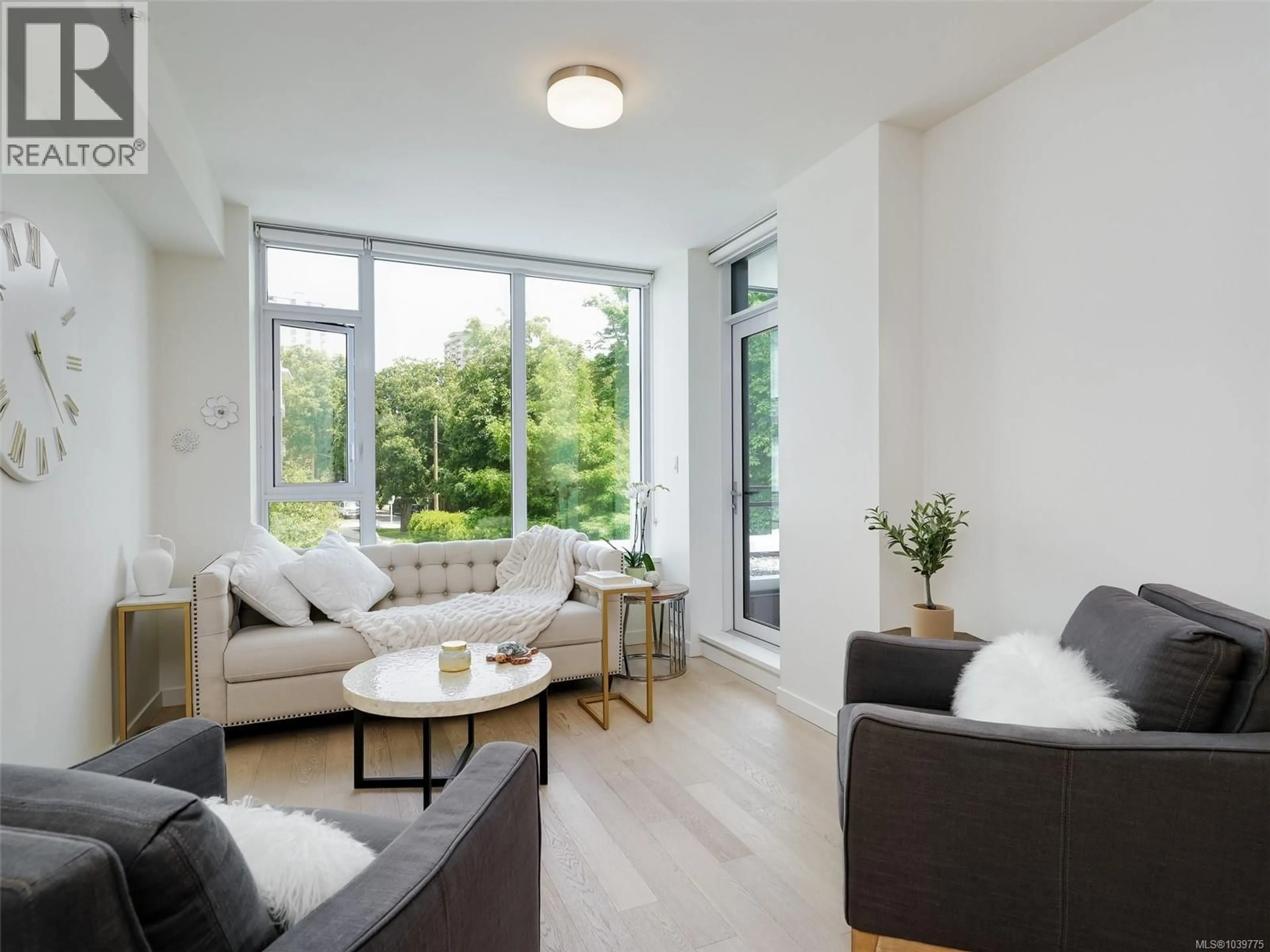 Living room with furniture, wood/laminate floor for 206 - 530 MICHIGAN STREET NORTH, Victoria British Columbia V8V0G2