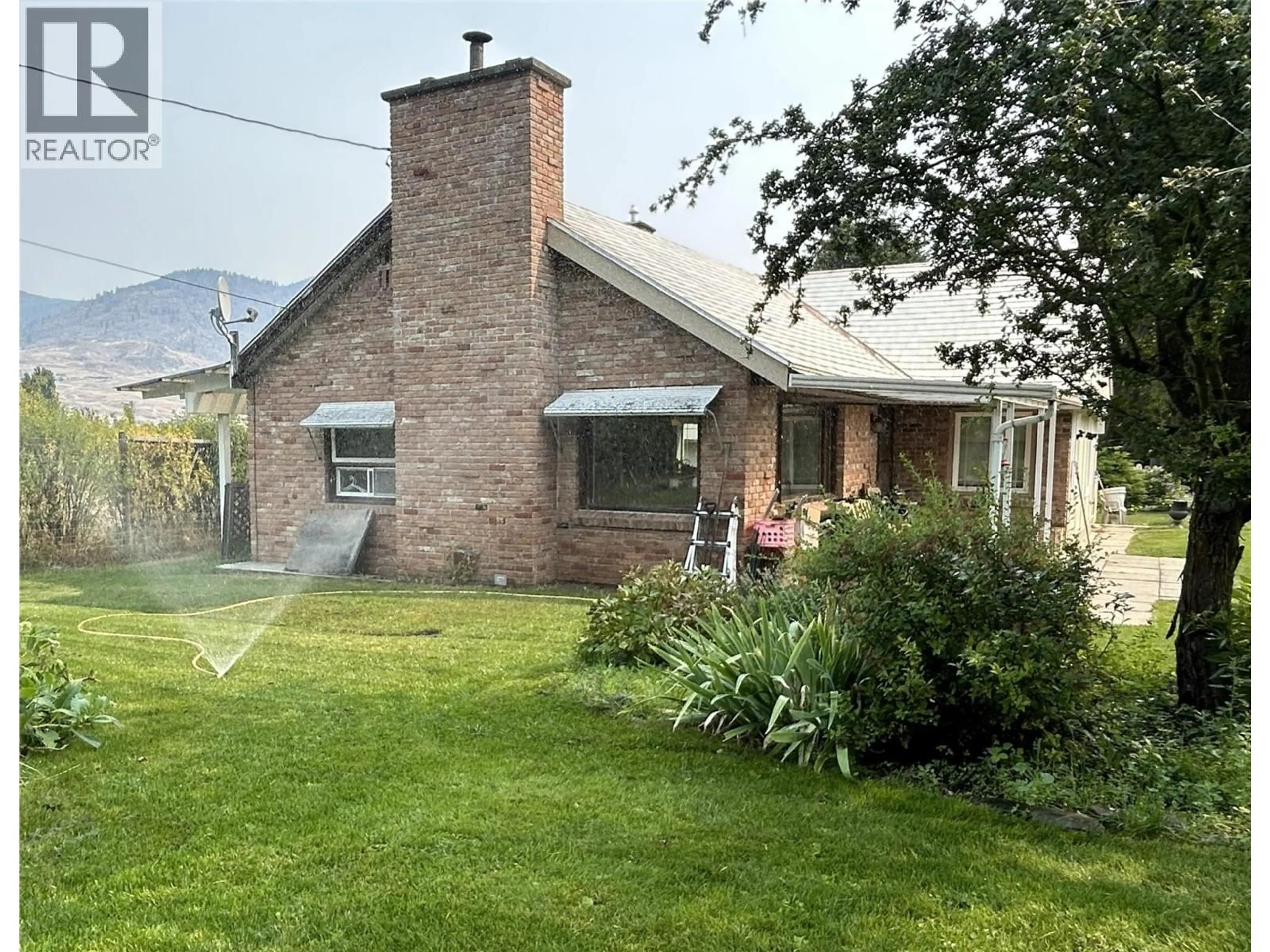 A pic from outside/outdoor area/front of a property/back of a property/a pic from drone, street for 5620 KENMORE ROAD, Grand Forks British Columbia V0H1H4