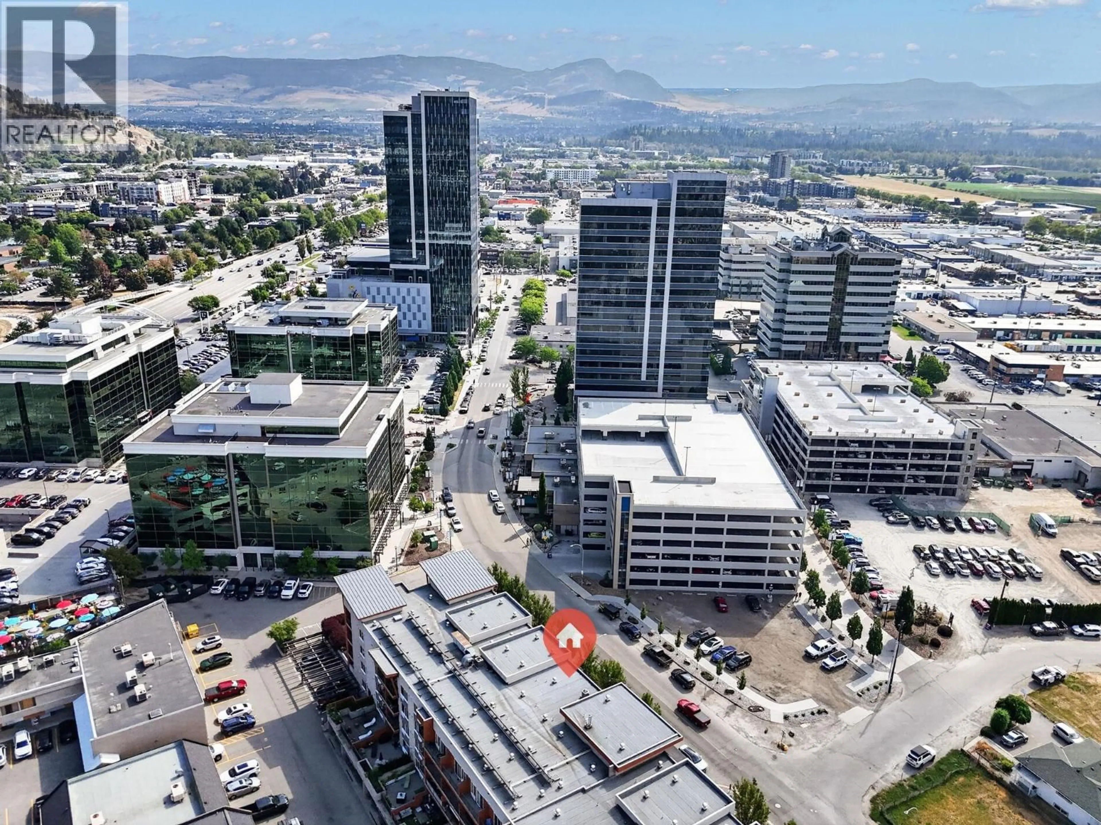 A pic from outside/outdoor area/front of a property/back of a property/a pic from drone, city buildings view from balcony for 306 - 1550 DICKSON AVENUE, Kelowna British Columbia V1Y9Y8