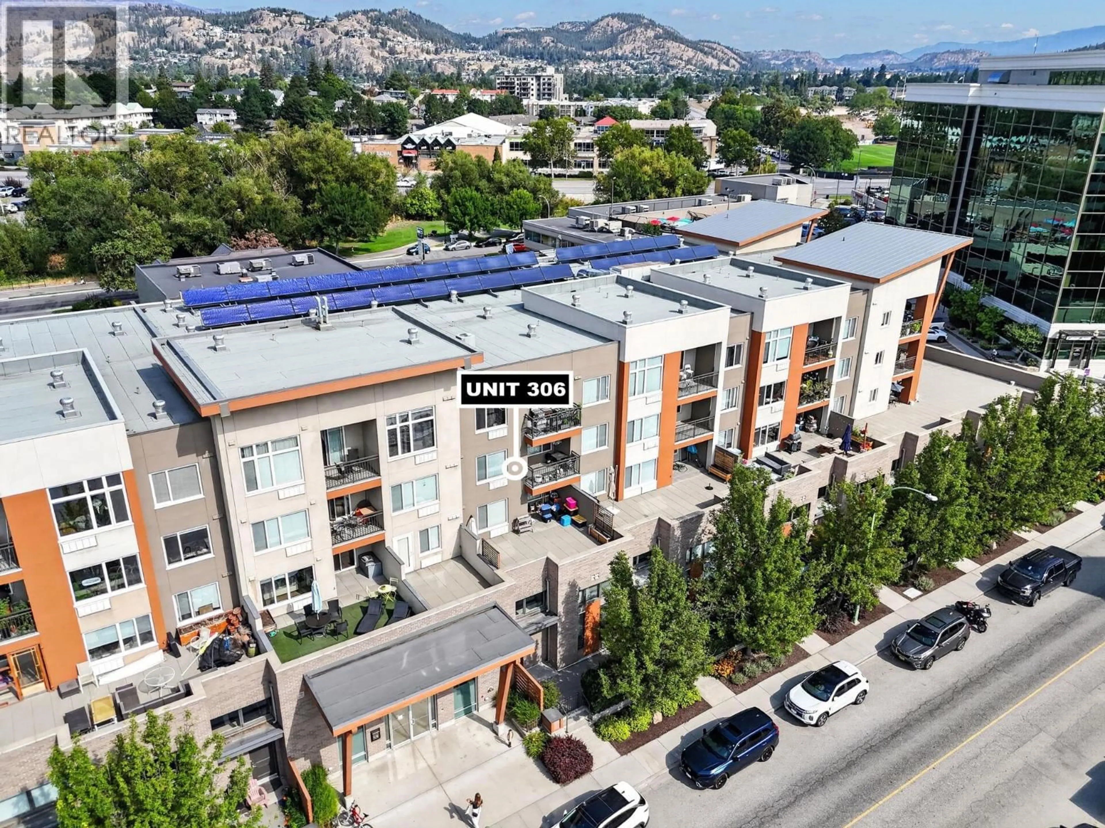 A pic from outside/outdoor area/front of a property/back of a property/a pic from drone, unknown for 306 - 1550 DICKSON AVENUE, Kelowna British Columbia V1Y9Y8