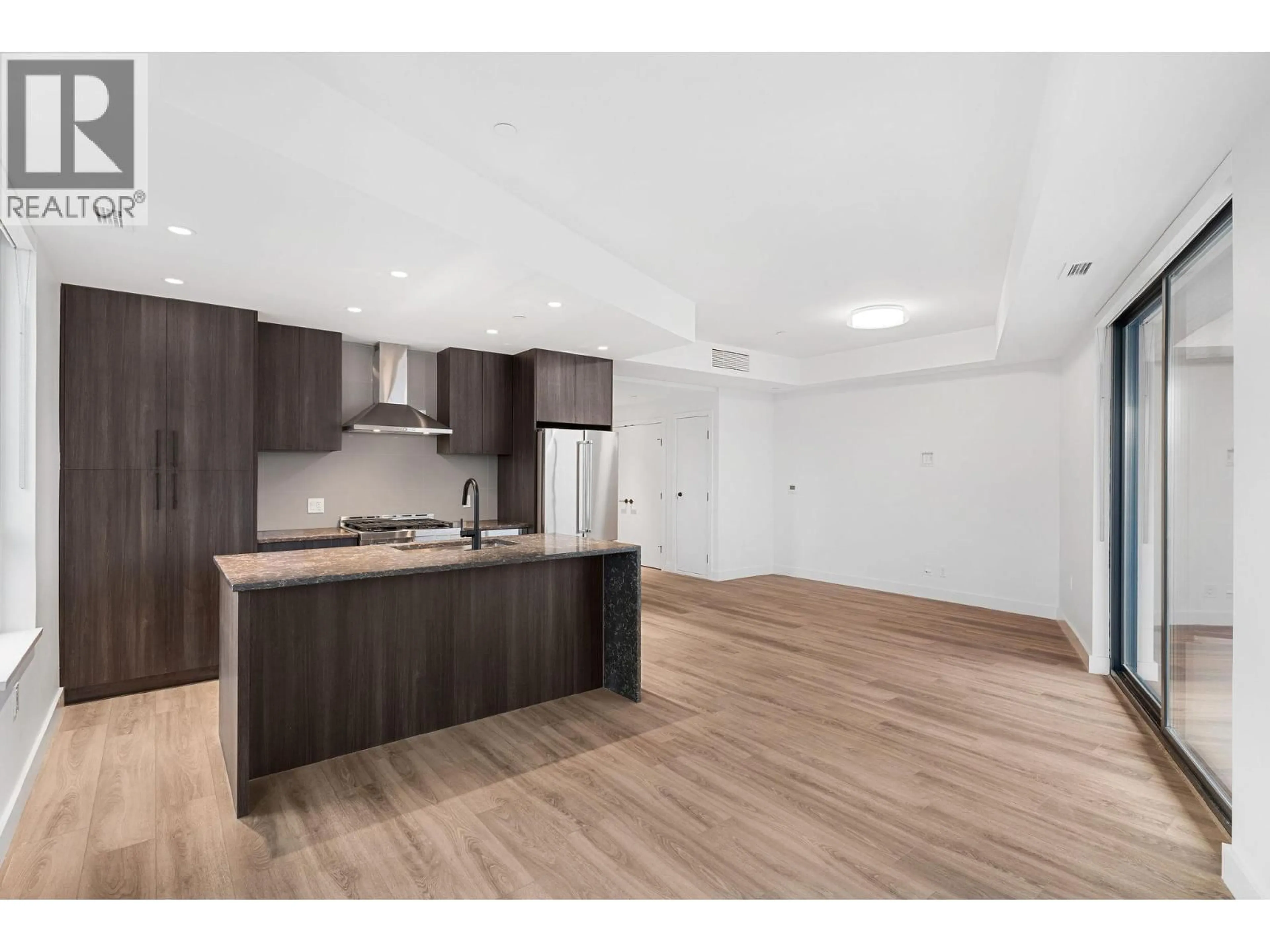 Open concept kitchen, wood/laminate floor for 216 - 3051 ABBOTT STREET, Kelowna British Columbia V1Y0P1