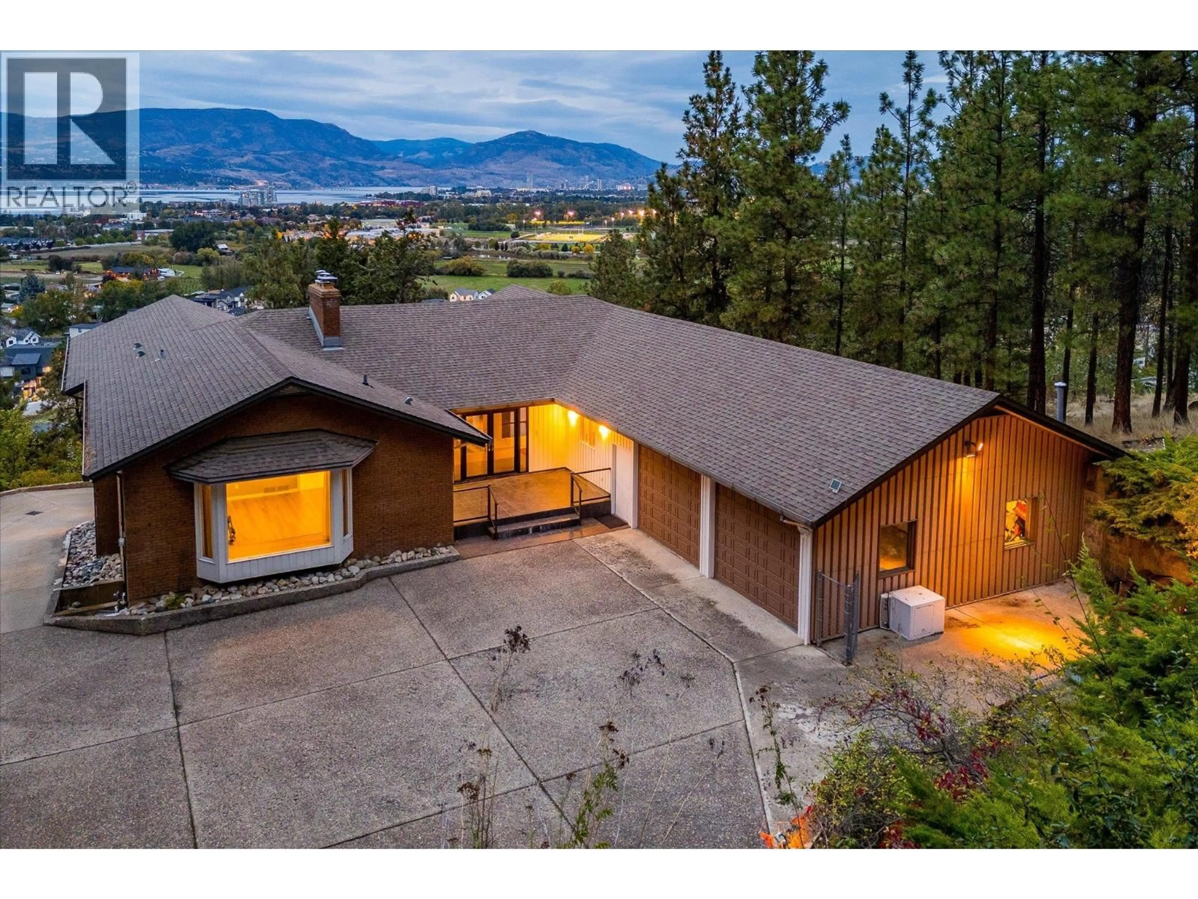 A pic from outside/outdoor area/front of a property/back of a property/a pic from drone, mountain view for 1045 BARTHOLOMEW COURT, Kelowna British Columbia V1W4N2