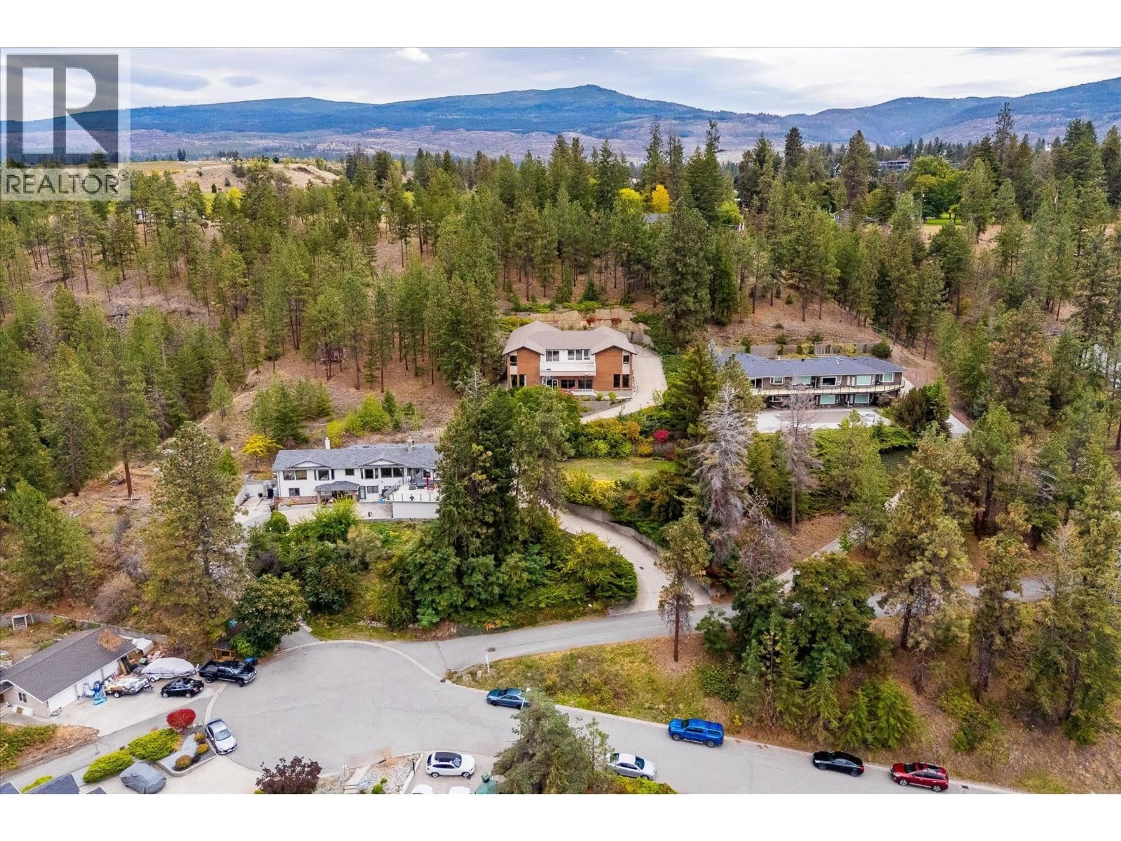 A pic from outside/outdoor area/front of a property/back of a property/a pic from drone, mountain view for 1045 BARTHOLOMEW COURT, Kelowna British Columbia V1W4N2