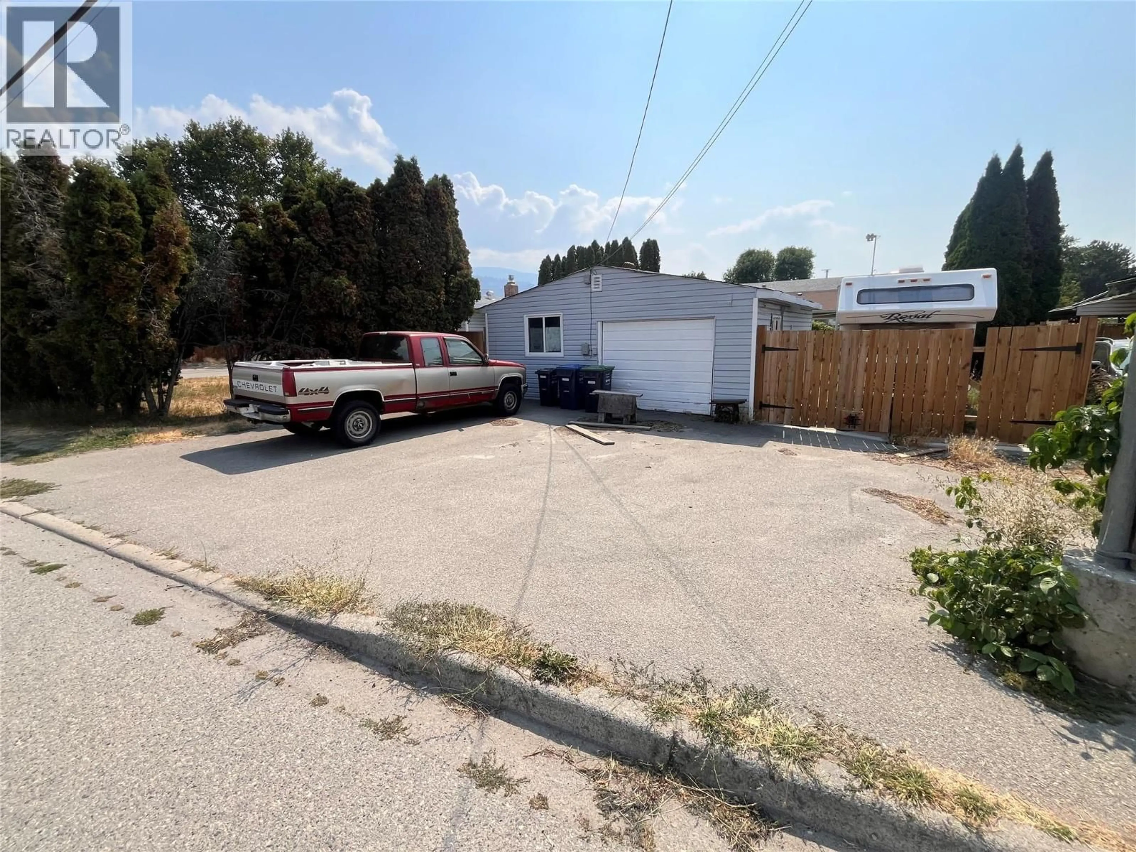 A pic from outside/outdoor area/front of a property/back of a property/a pic from drone, street for 302 GREEN AVENUE WEST, Penticton British Columbia V2A3T3