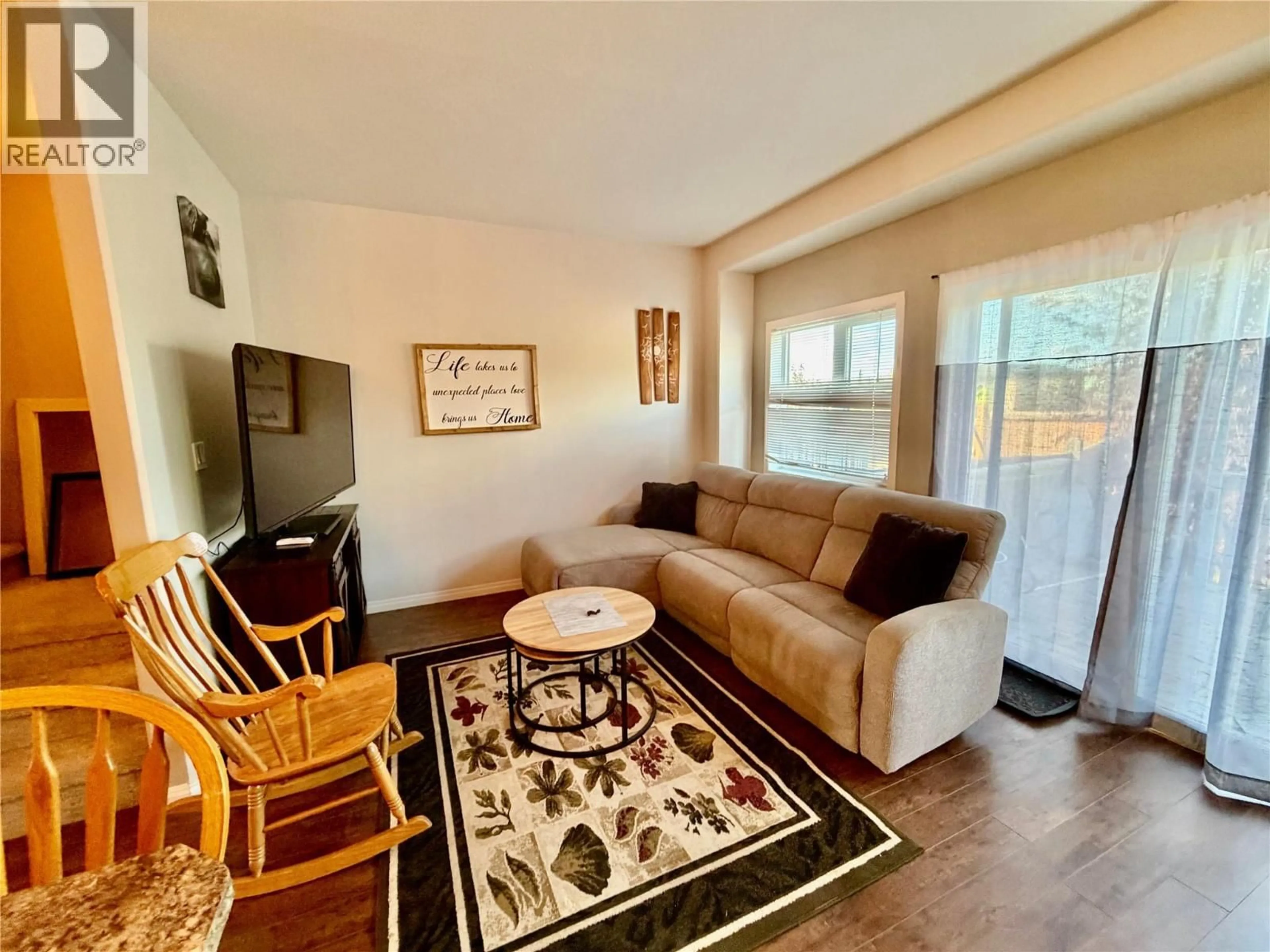 Living room with furniture, wood/laminate floor for 1556 LORAN DRIVE, Dawson Creek British Columbia V1G1B6