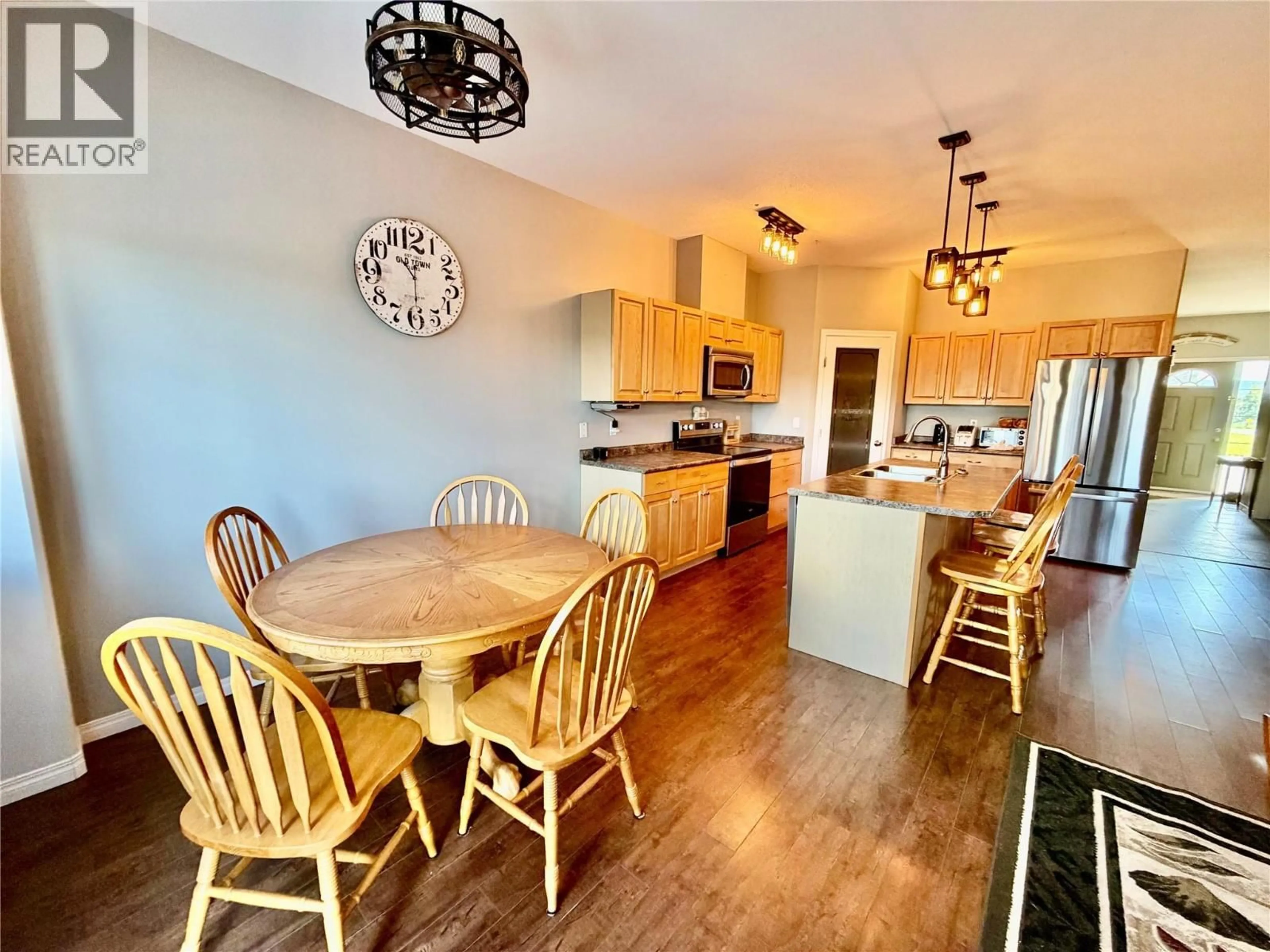 Open concept kitchen, wood/laminate floor for 1556 LORAN DRIVE, Dawson Creek British Columbia V1G1B6