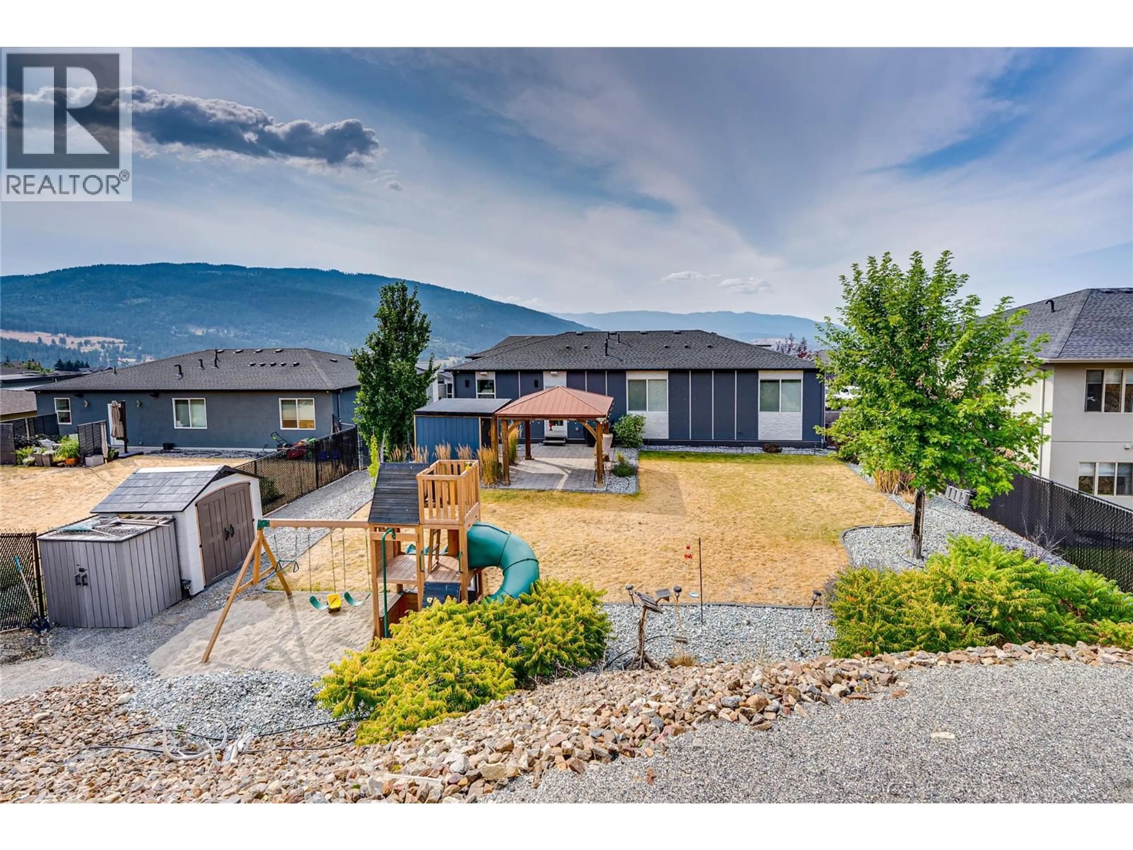 A pic from outside/outdoor area/front of a property/back of a property/a pic from drone, mountain view for 7180 APEX DRIVE, Vernon British Columbia V1B4E4