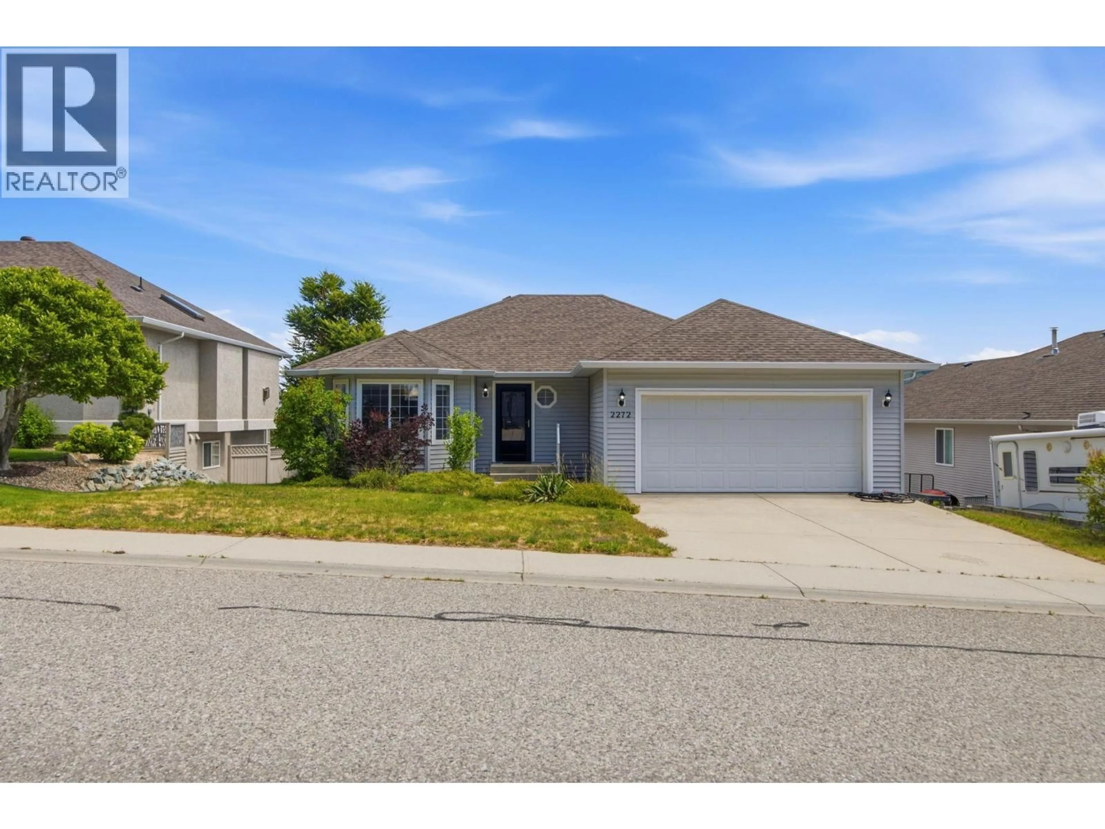 Home with vinyl exterior material, street for 2272 SHANNON HILLS DRIVE, West Kelowna British Columbia V4T2P1