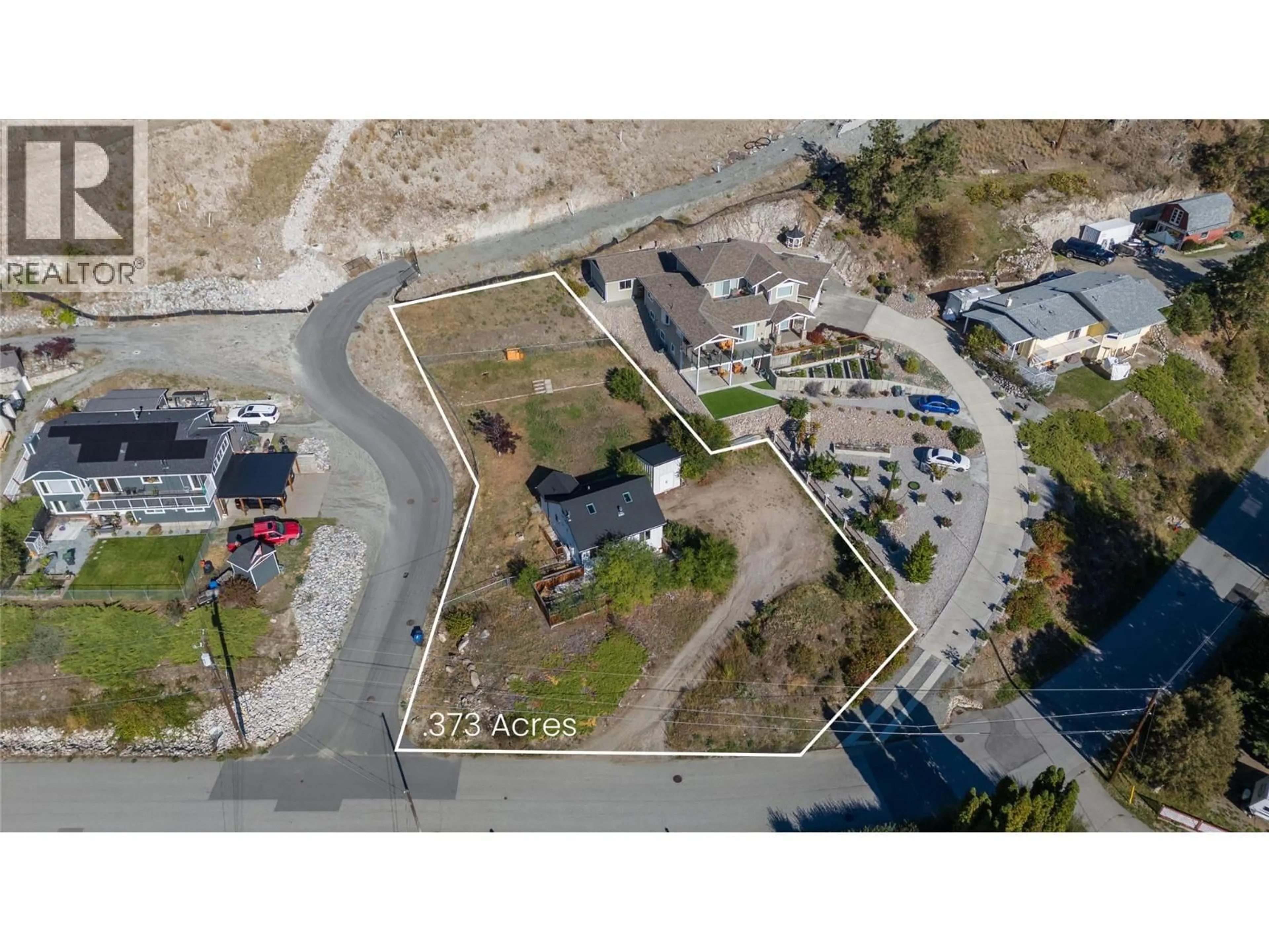 A pic from outside/outdoor area/front of a property/back of a property/a pic from drone, street for 5940 VICTORIA STREET, Peachland British Columbia V0H1X4