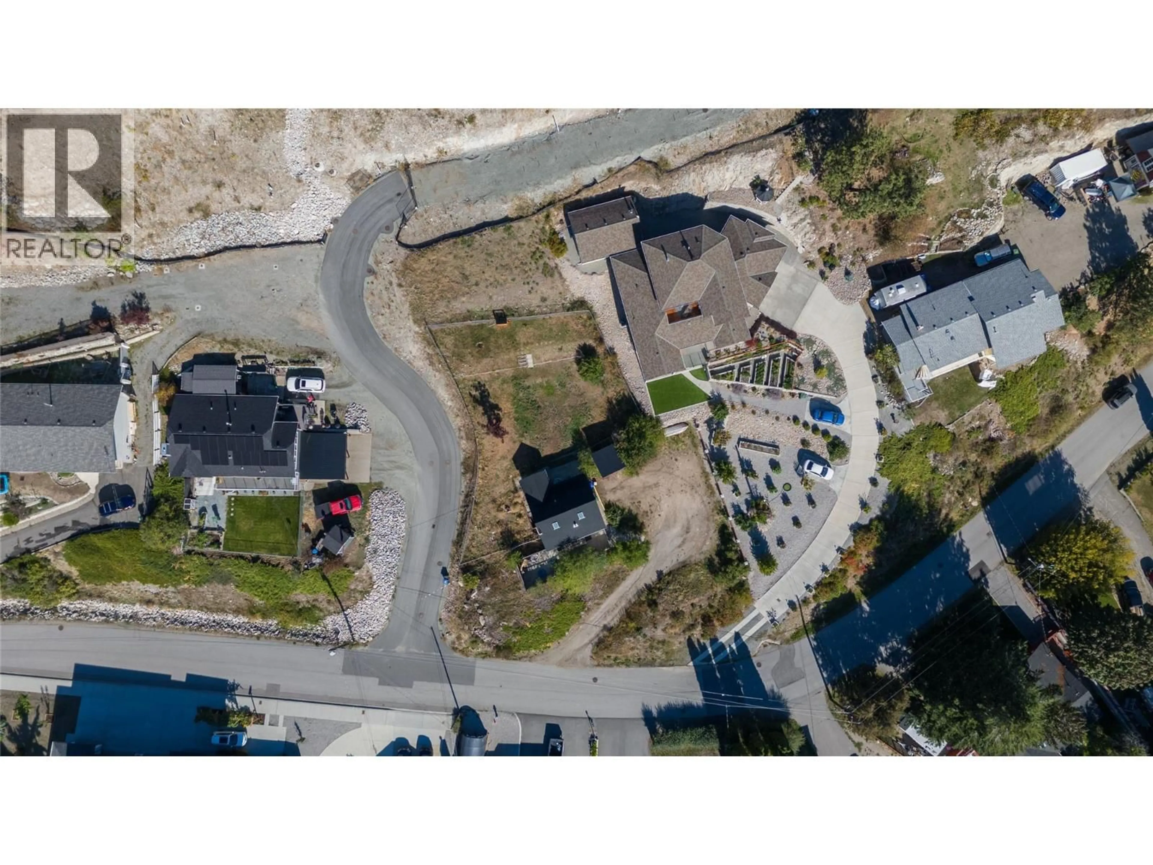 A pic from outside/outdoor area/front of a property/back of a property/a pic from drone, street for 5940 VICTORIA STREET, Peachland British Columbia V0H1X4