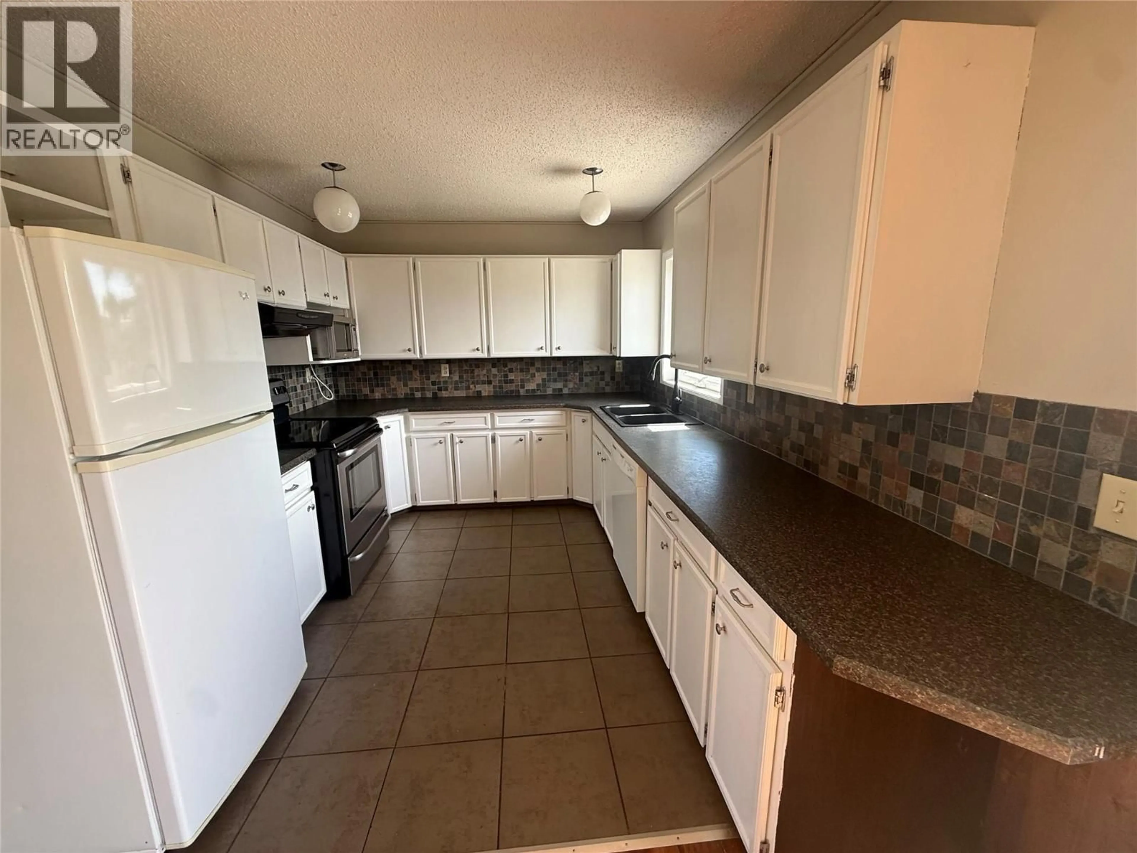 Standard kitchen, ceramic/tile floor for 925 CORNWALL CRESCENT, Dawson Creek British Columbia V1G1P1