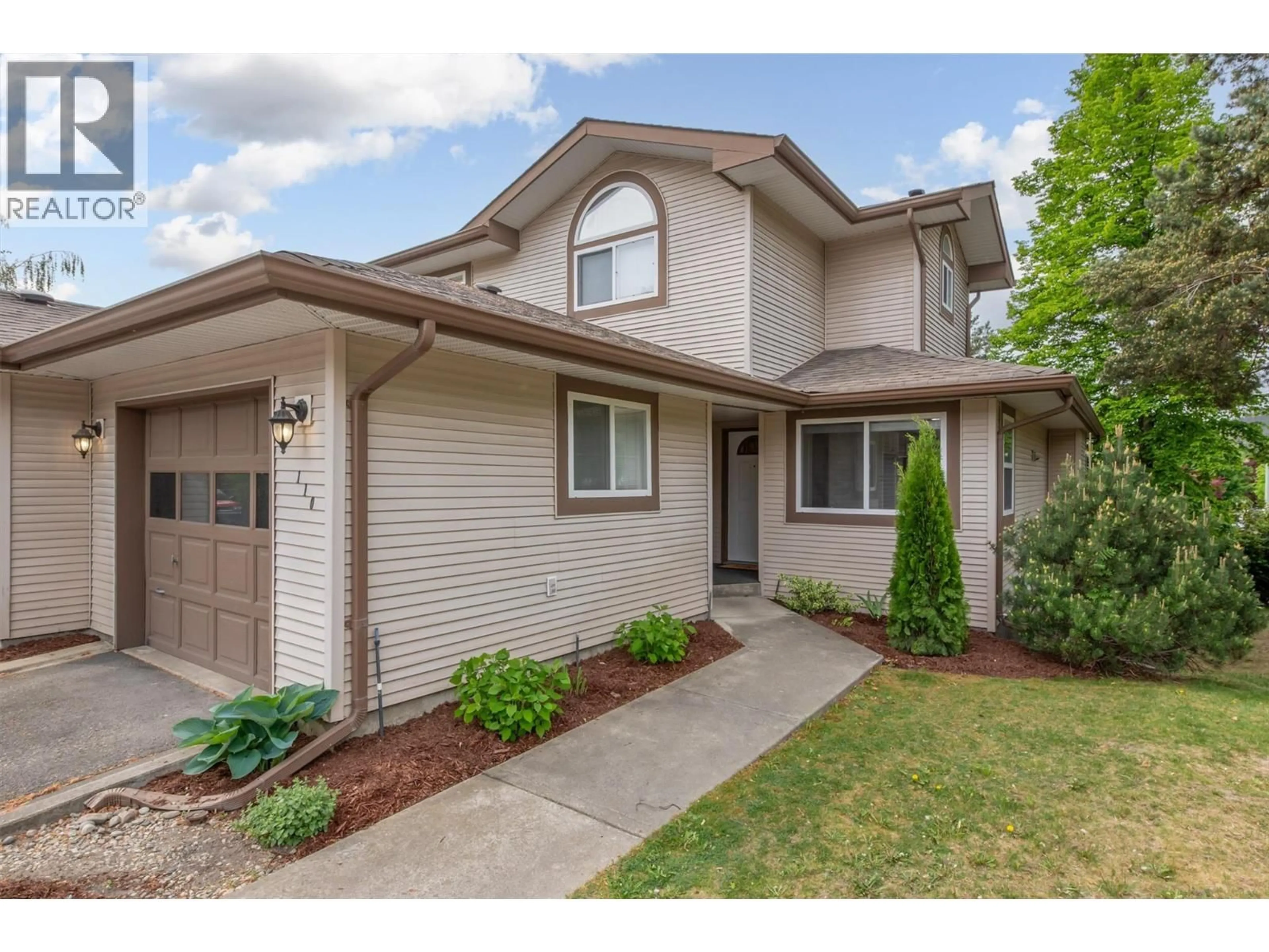 Home with brick exterior material, street for 110 - 133 WYNDHAM CRESCENT, Kelowna British Columbia V1V1Y8