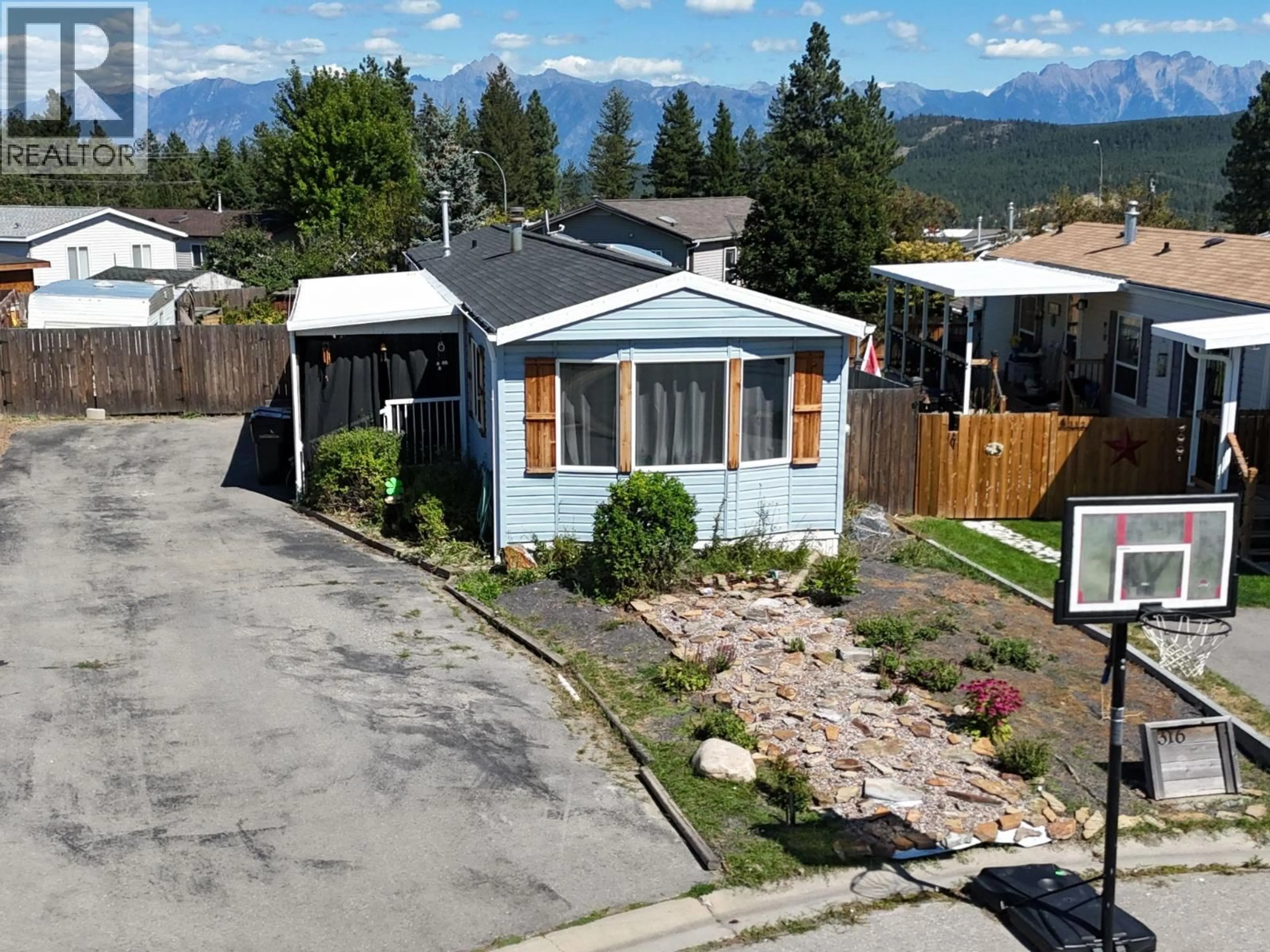 A pic from outside/outdoor area/front of a property/back of a property/a pic from drone, mountain view for 316 MISSION PLACE, Cranbrook British Columbia V1C6P7