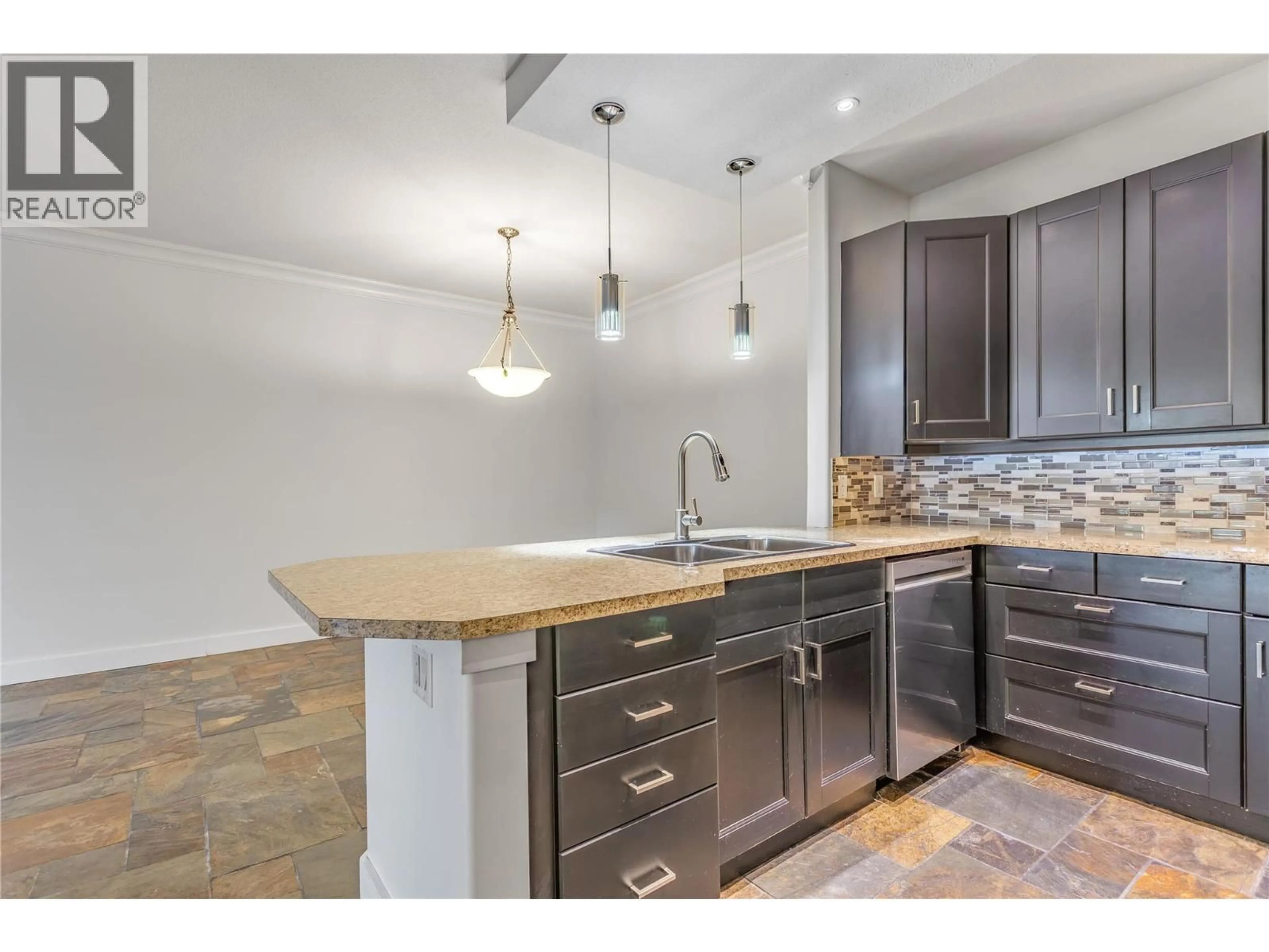 Open concept kitchen, unknown for 103 - 2300 BENVOULIN ROAD, Kelowna British Columbia V1W2C6